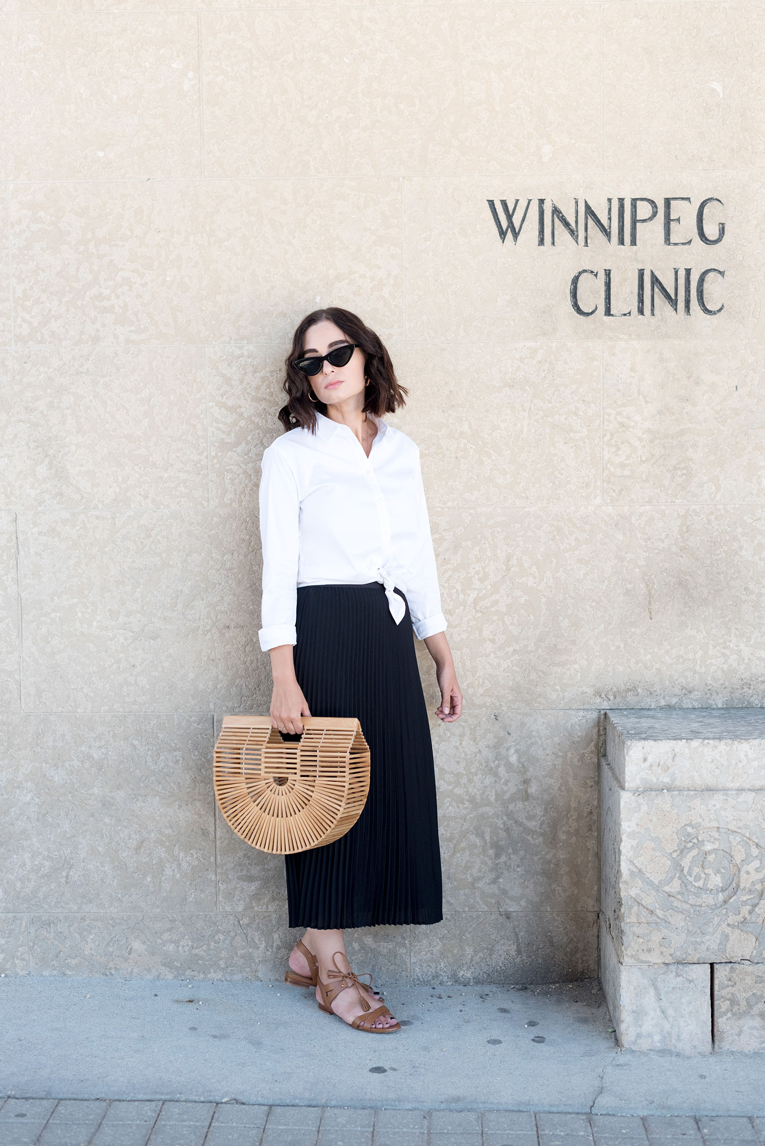 Top Winnipeg fashion blogger Cee Fardoe of Coco & Vera wears a white Uniqlo blouse and carries a vintage cage bag