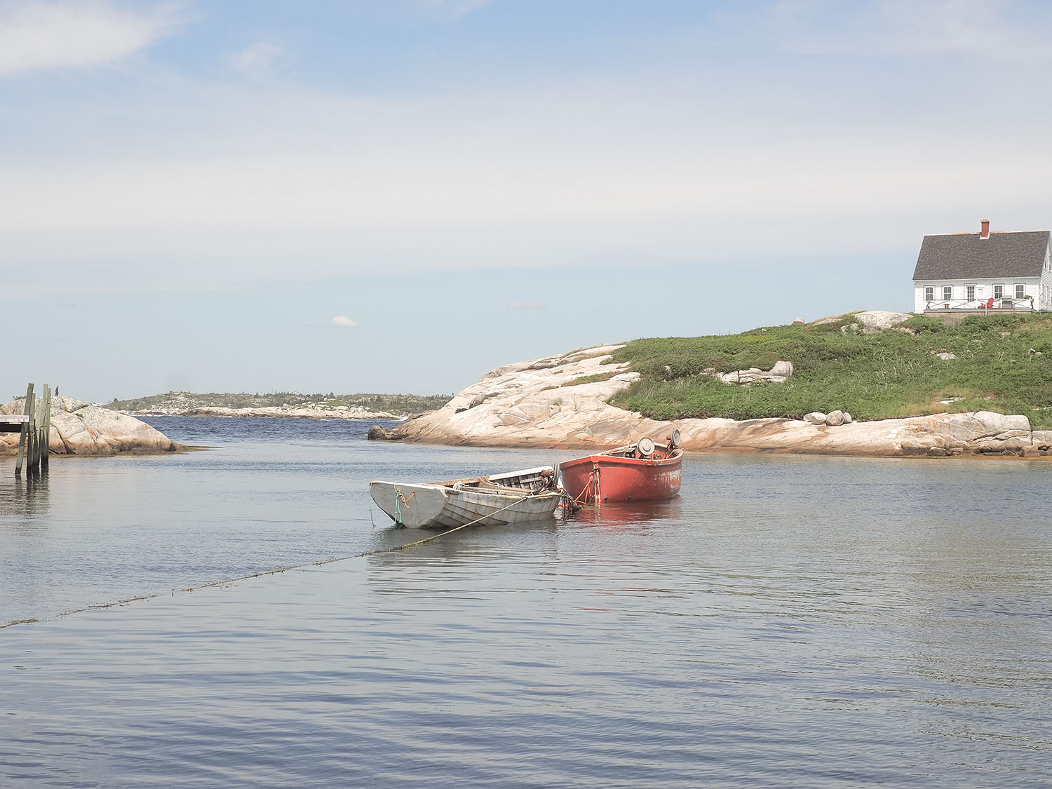 Two boats moored in the bay at Peggy's Cove in Nova Scotia, as captured by top Canadian travel blogger Cee Fardoe of Coco & Vera