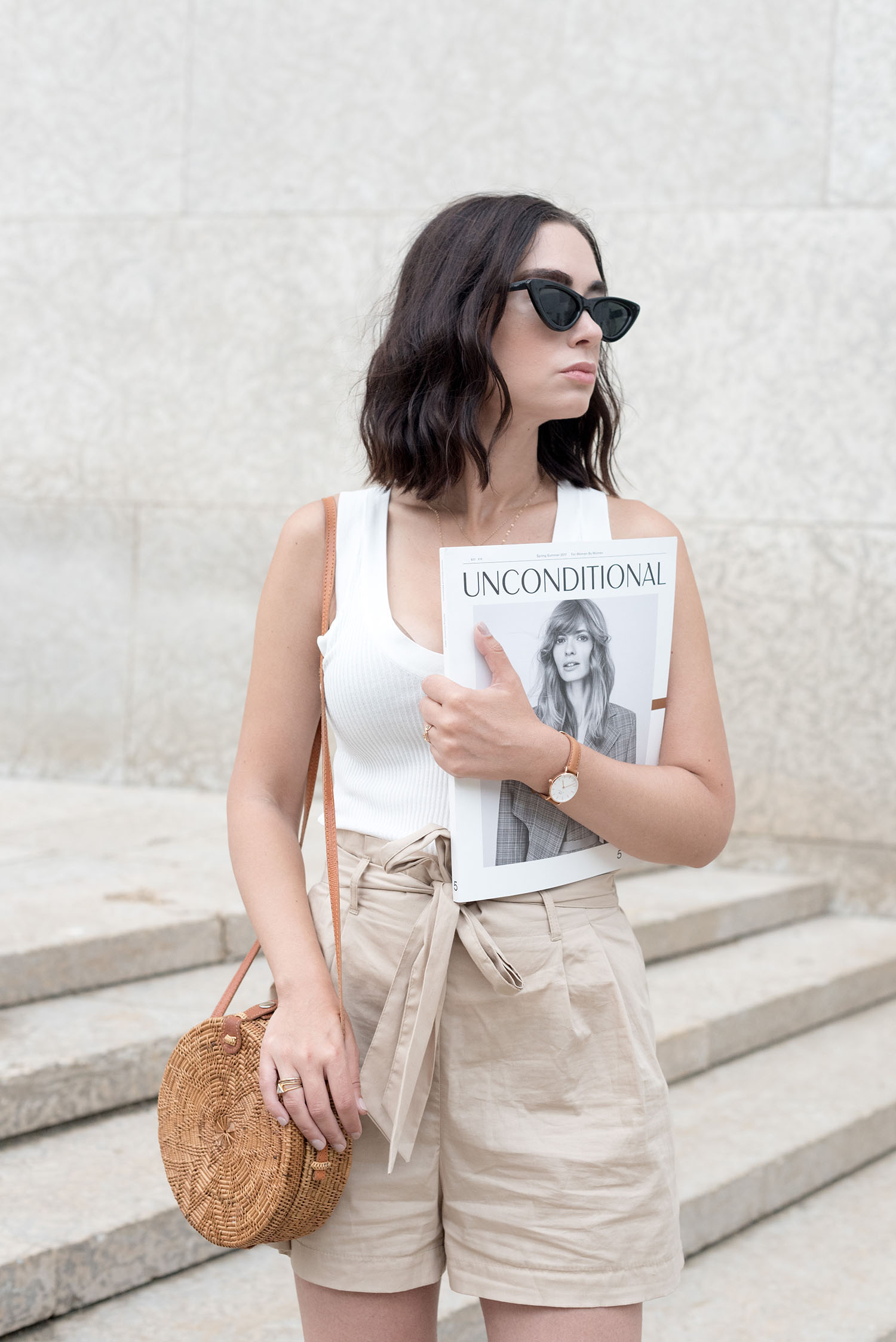 Portrait of top Canadian style blogger Cee Fardoe of Coco & Vera wearing Zara cat eye sunglasses and carrying a copy of Unconditional magazine