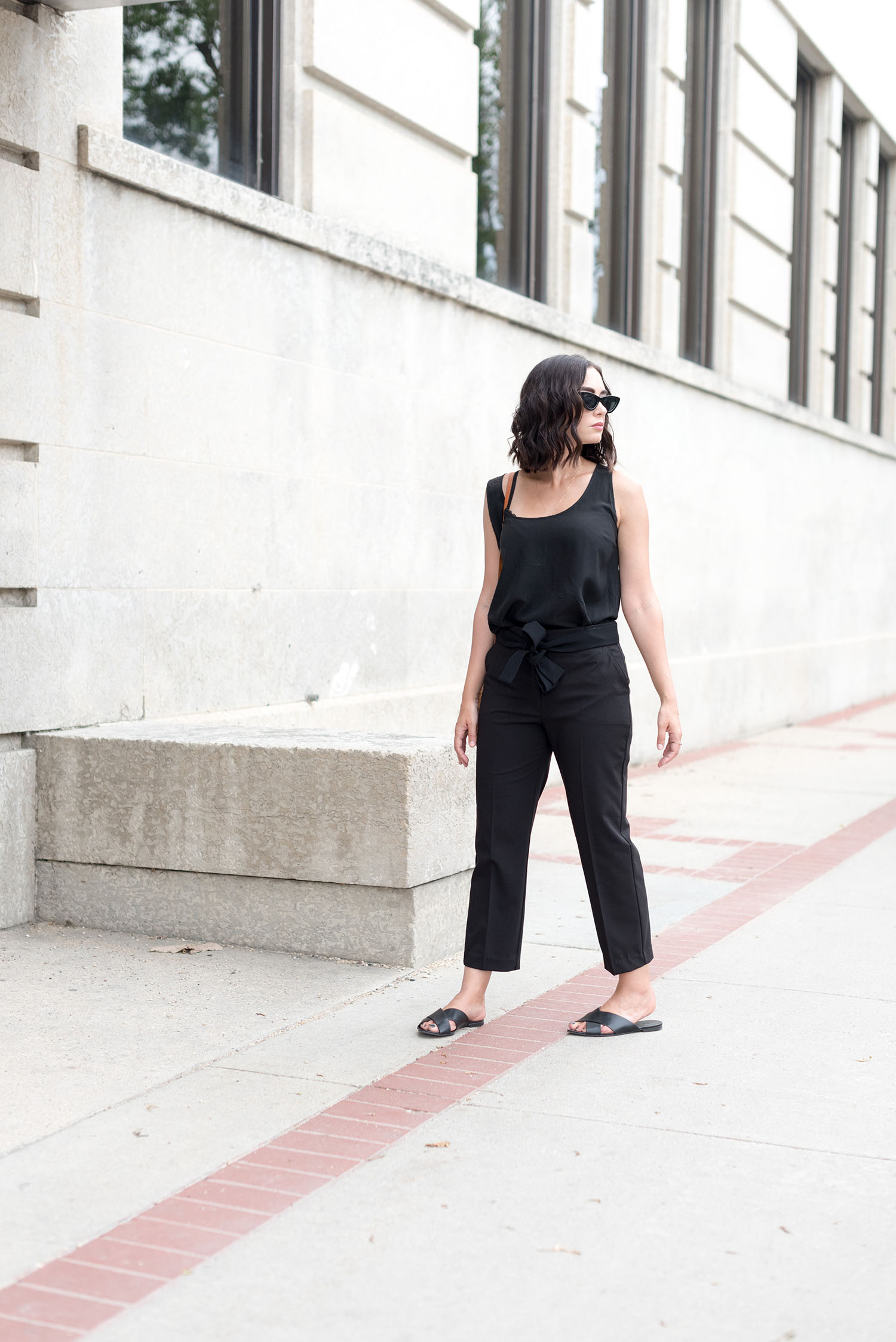 Top Winnipeg fashion blogger Cee Fardoe of Coco & Vera walks on Corydon avenue wearing Mango cropped trousers and Zara cat eye sunglasses