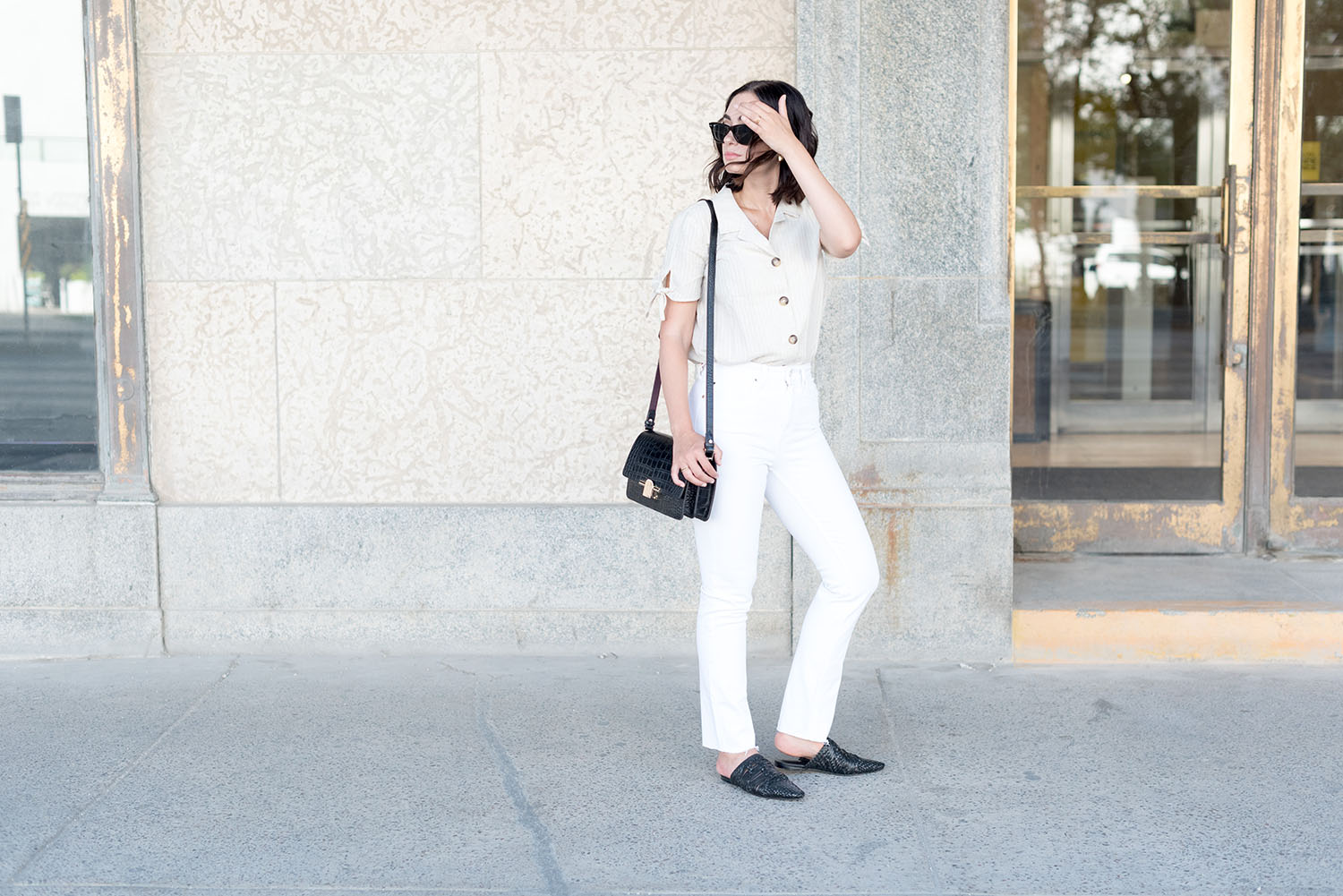 Top Winnipeg fashion blogger Cee Fardoe of Coco & Vera carries a Massimo Dutti bag and wears Mango white jeans
