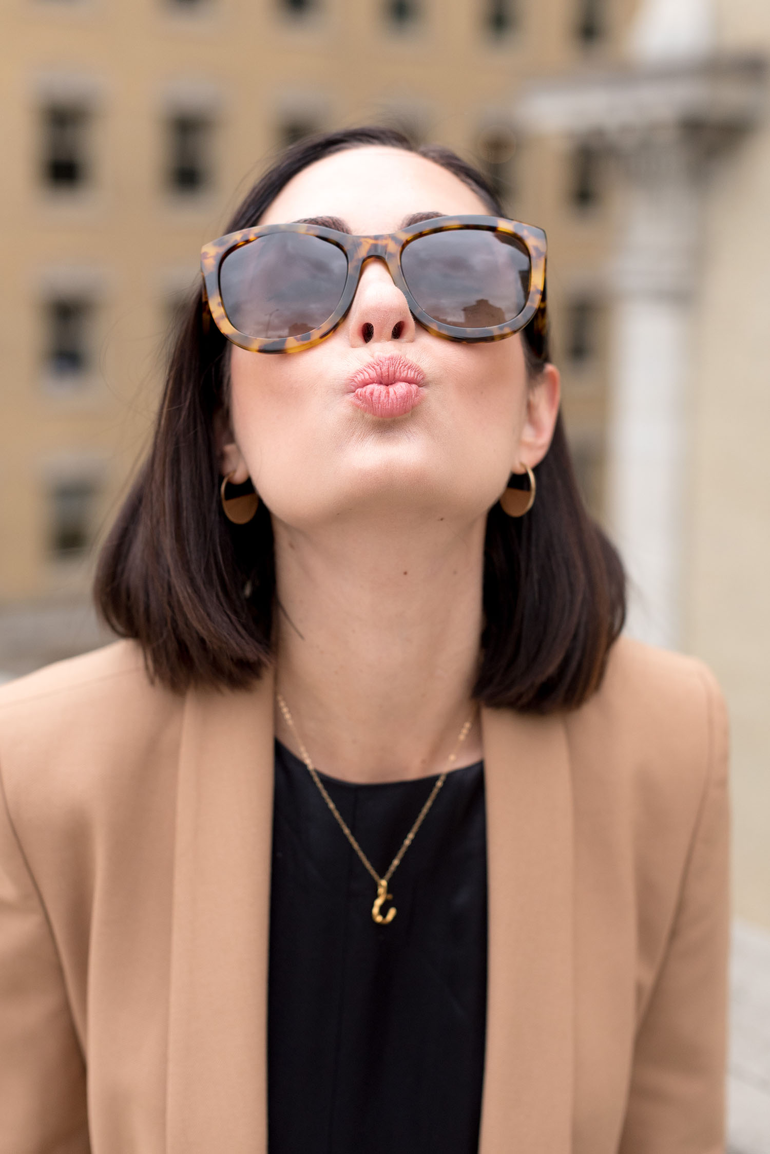 Portrait of top Canadian fashion blogger Cee Fardoe of Coco & Vera wearing a Celine alphabet necklace and Anine Bing sunglasses