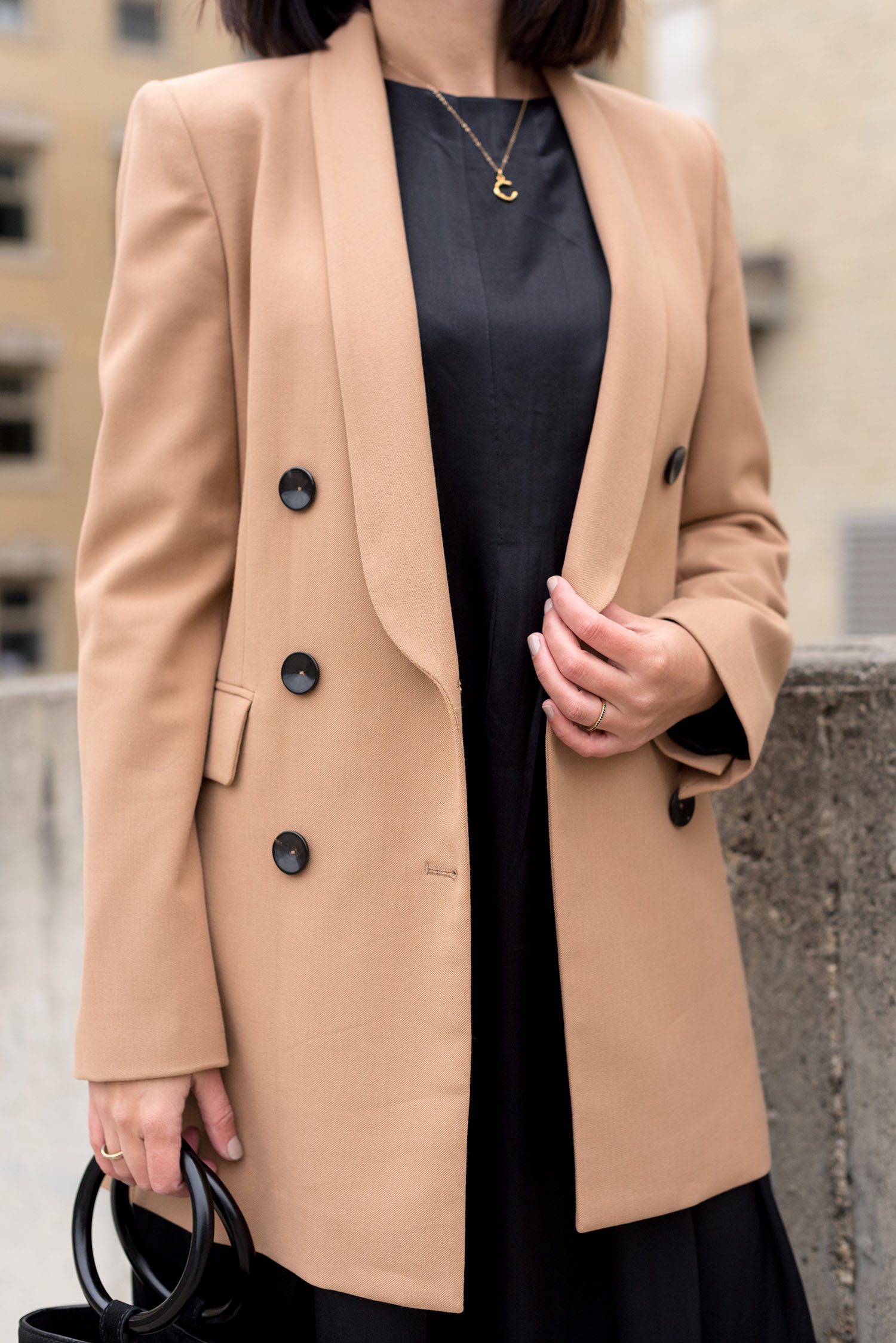 Outfit details on top Canadian fashion blogger Cee Fardoe of Coco & Vera, including a Zara camel blazer and Celine alphabet necklace