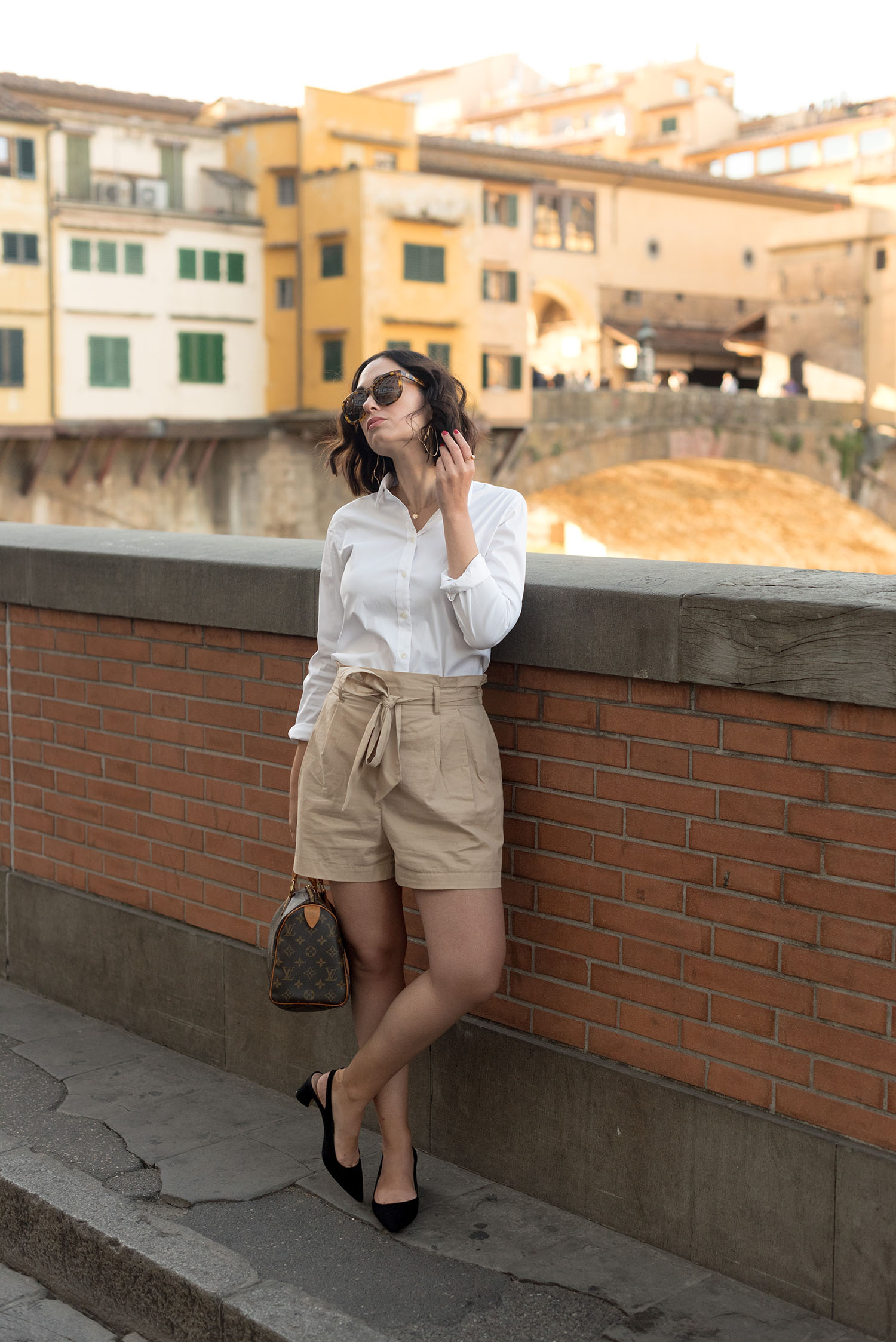 Top Winnipeg fashion blogger Cee Fardoe of Coco & Vera in Florence, Italy, wearing a Uniqlo white blouse and Mango pumps