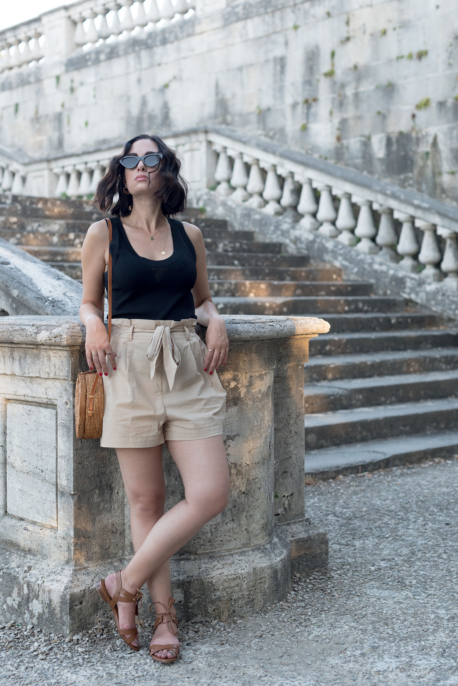Top Winnipeg fashion blogger Cee Fardoe of Coco & Vera wears Zara shorts and Sezane sandals in Florence, Italy