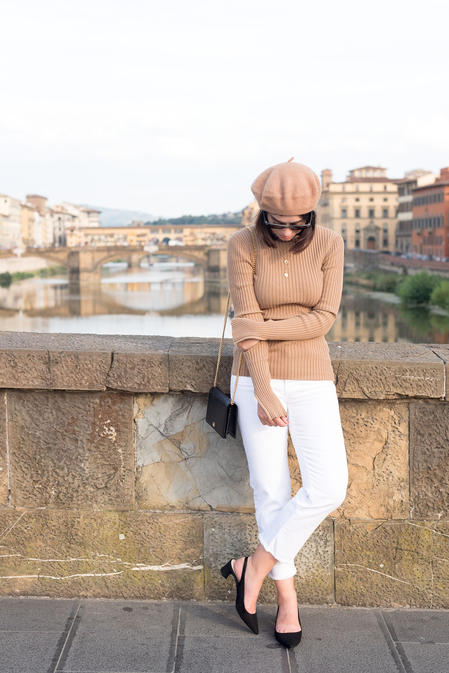 Top Winnipeg fashion blogger Cee Fardoe of Coco & Vera in Florence, Italy, wearing an H&M ribbed sweater and white Mavi jeans
