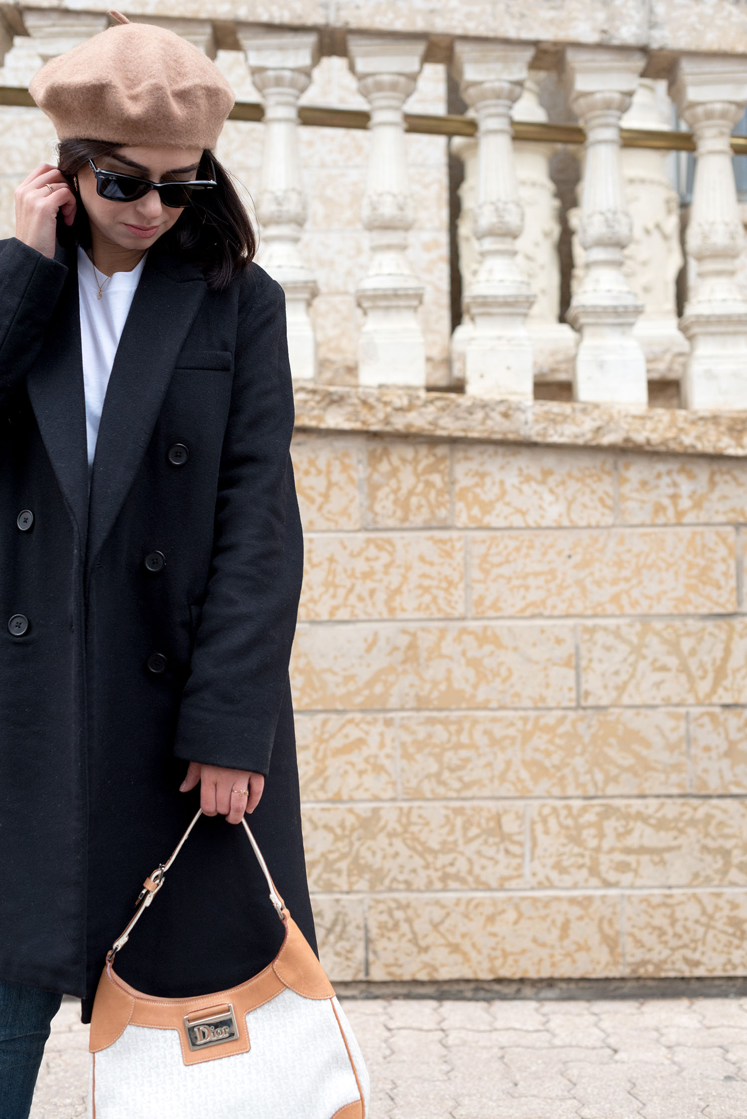 Portrait of top Canadian fashion blogger Cee Fardoe of Coco & Vera, wearing RayBan Wayfarer sunglasses and carrying a Dior bag