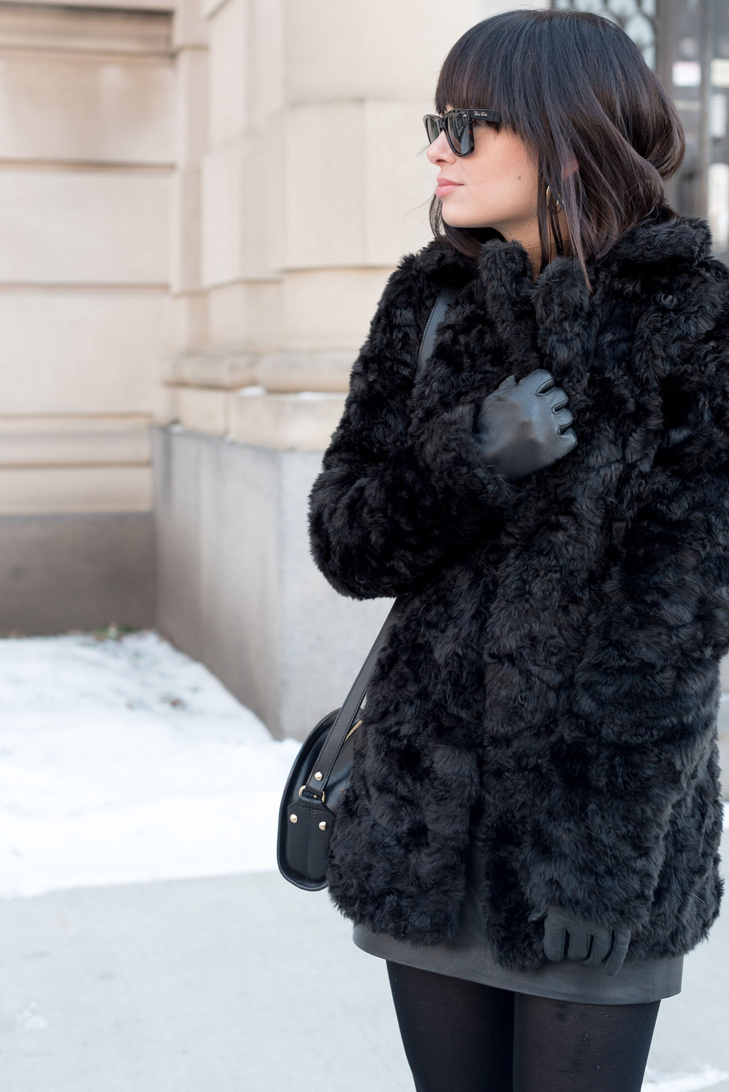 Portrait of top Winnipeg fashion blogger Cee Fardoe of Coco & Vera, wearing RayBan Wayfarer sunglasses and a Le Chateau black faux fur coat