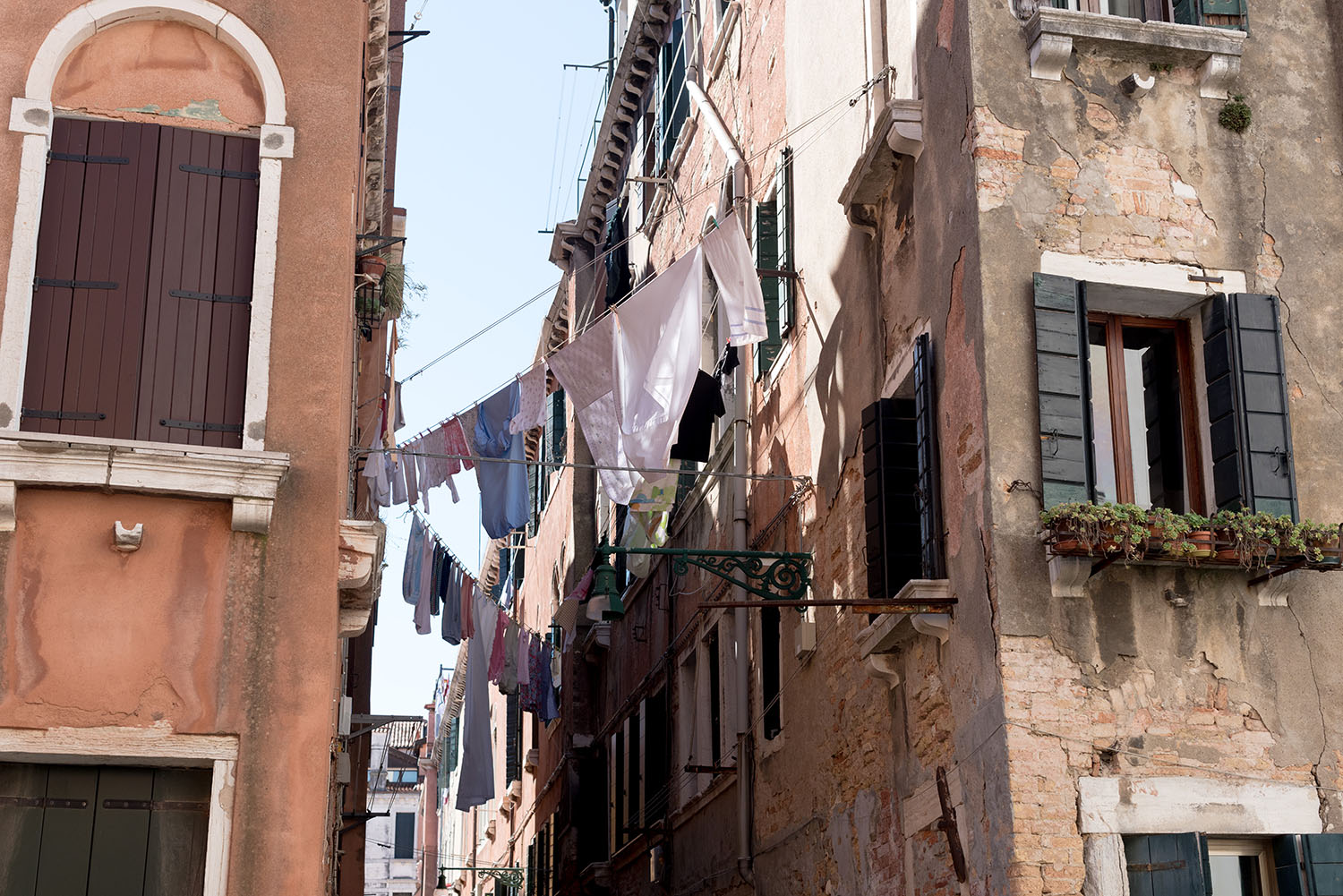 Laundry hangs between residential buildings in Venice, as photographed by top Canadian travel blogger Cee Fardoe of Coco & Vera