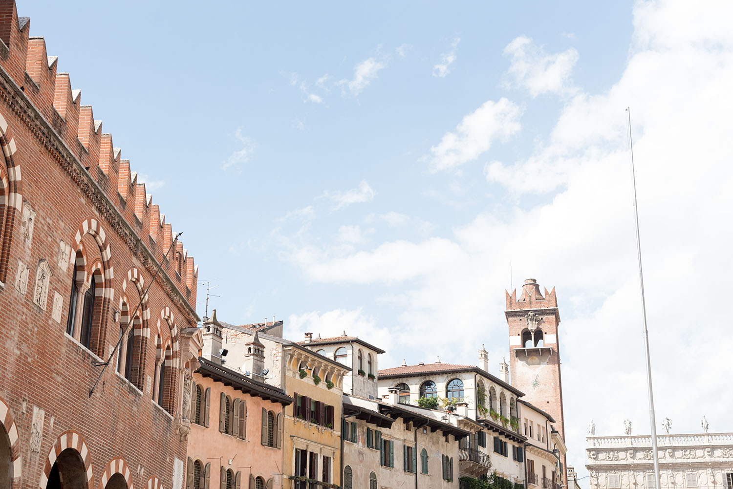 Medieval buildings in Verona's main square, as photographed by top Winnipeg travel blogger Cee Fardoe of Coco & Vera