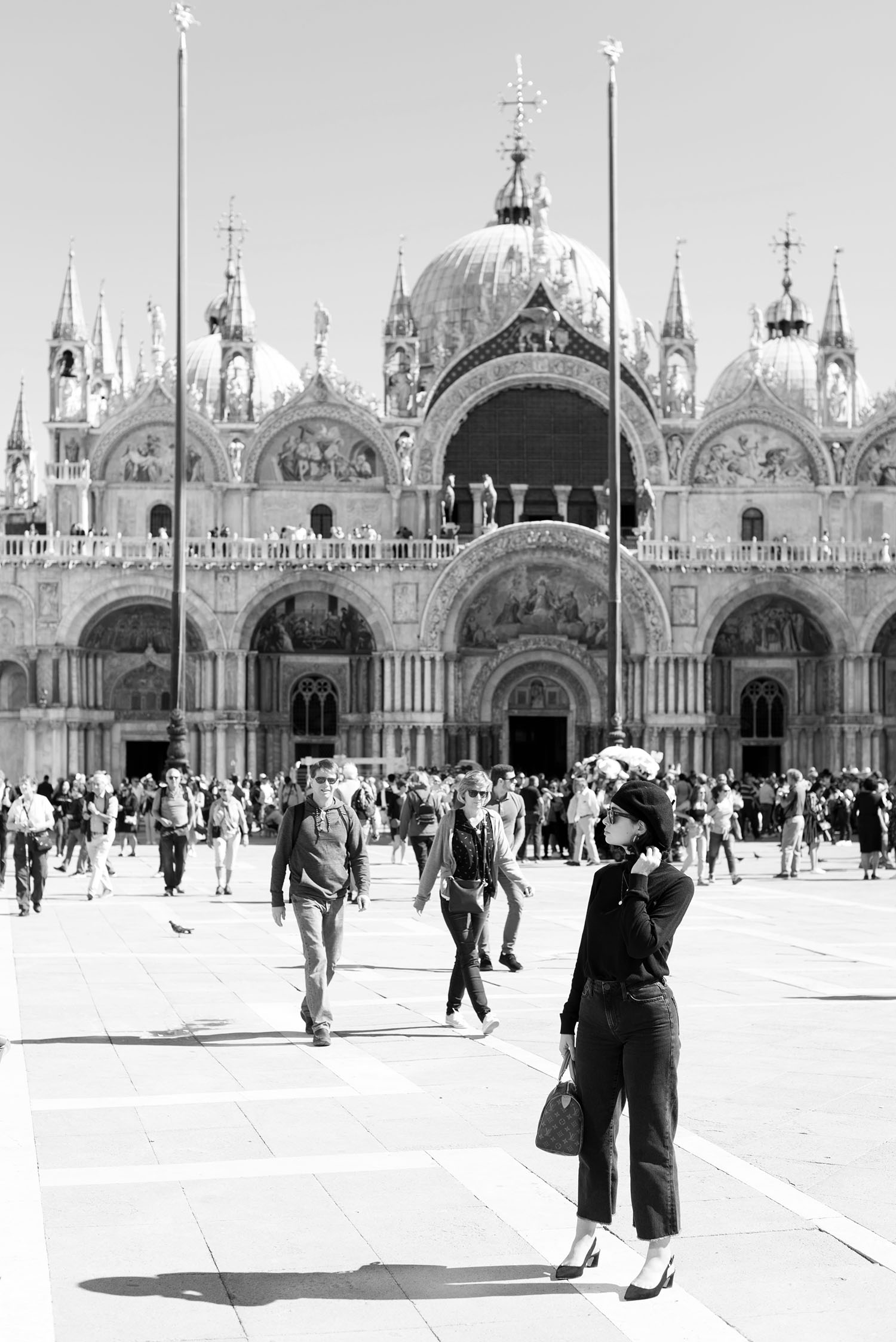 Top Canadian travel blogger Cee Fardoe of Coco & Vera stands at Piazza San Marco in Venice, Italy