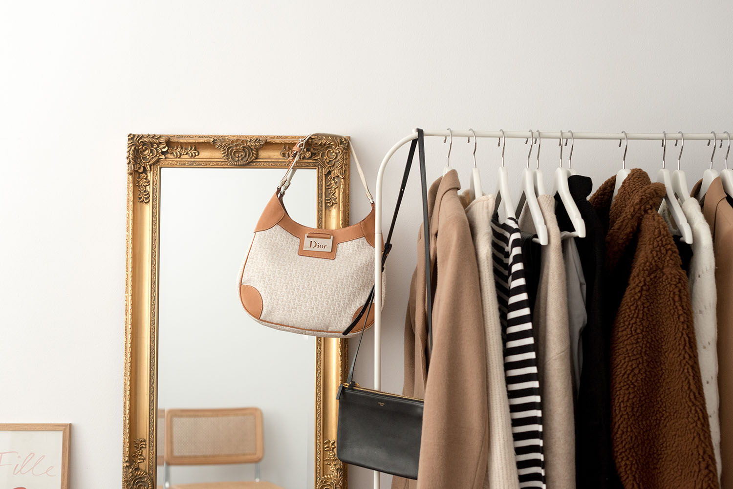 A Dior handbag and Celine trio bag in the closet of top Canadian fashion blogger Cee Fardoe of Coco & Vera