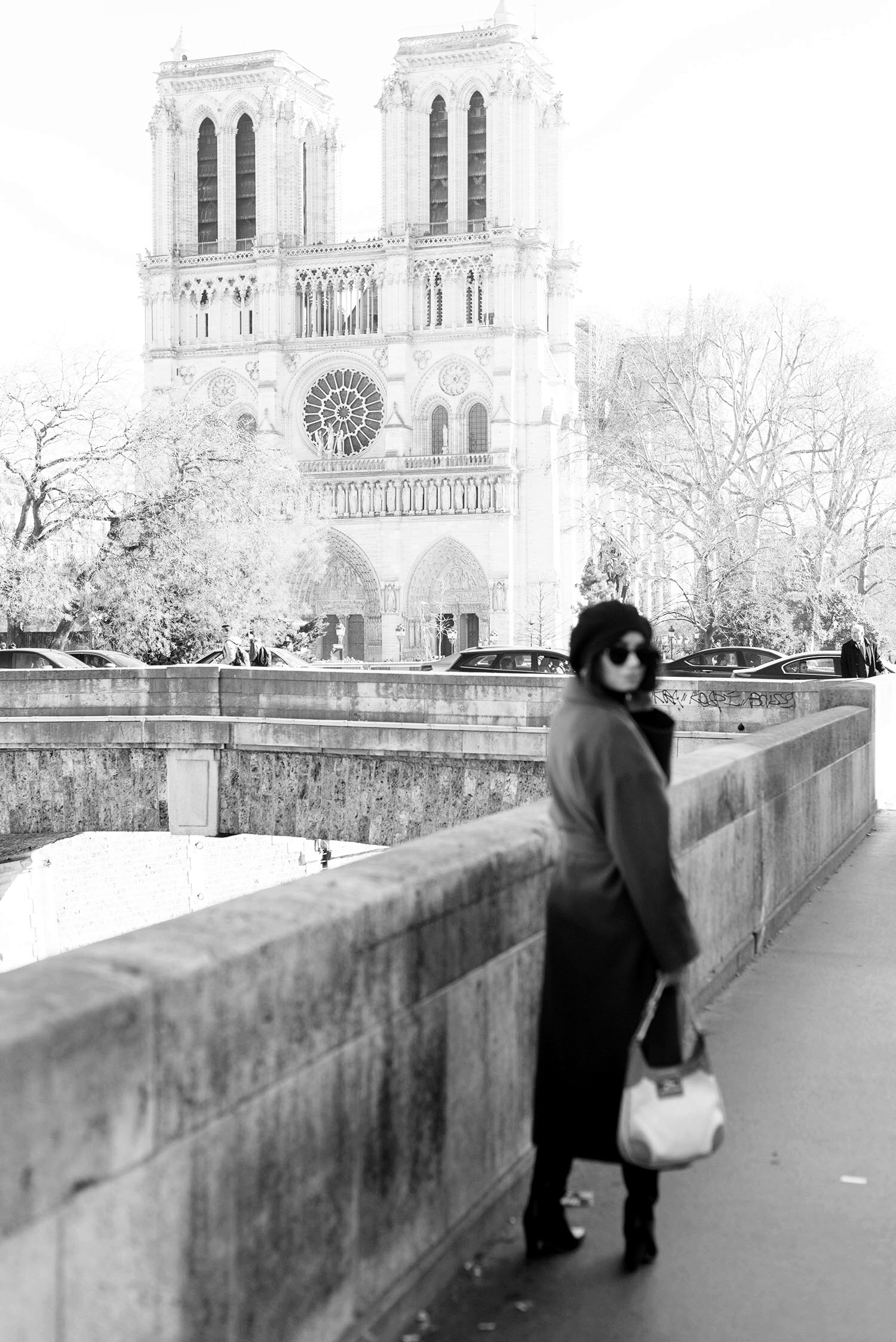Top Canadian fashion blogger Cee Fardoe at Notre-Dame Cathedral in Paris, wearing & Other Stories sunglasses and a Zara wrap coat