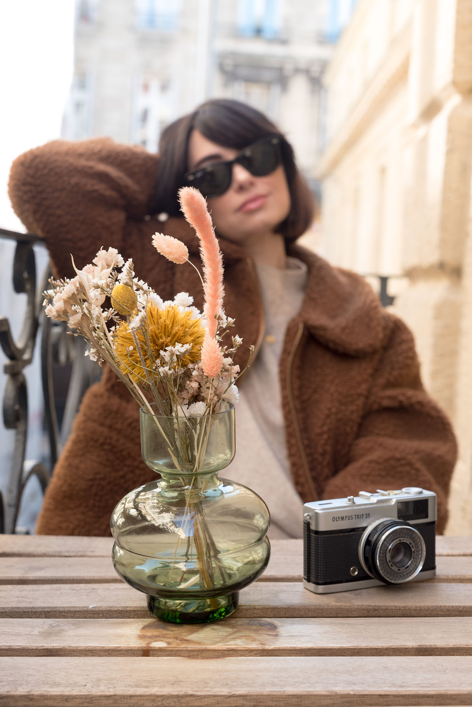 Portrait of top Canadian fashion blogger Cee Fardoe of Coco & Vera at La Maison Fernand in Bordeaux, wearing an H&M sweater and RayBan Wayfarer sunglasses