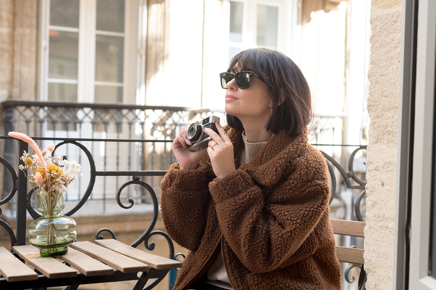 Portrait of top Winnipeg fashion blogger Cee Fardoe of Coco & Vera in Bordeaux, France, wearing RayBan Wayfarer sunglasses and a teddy coat