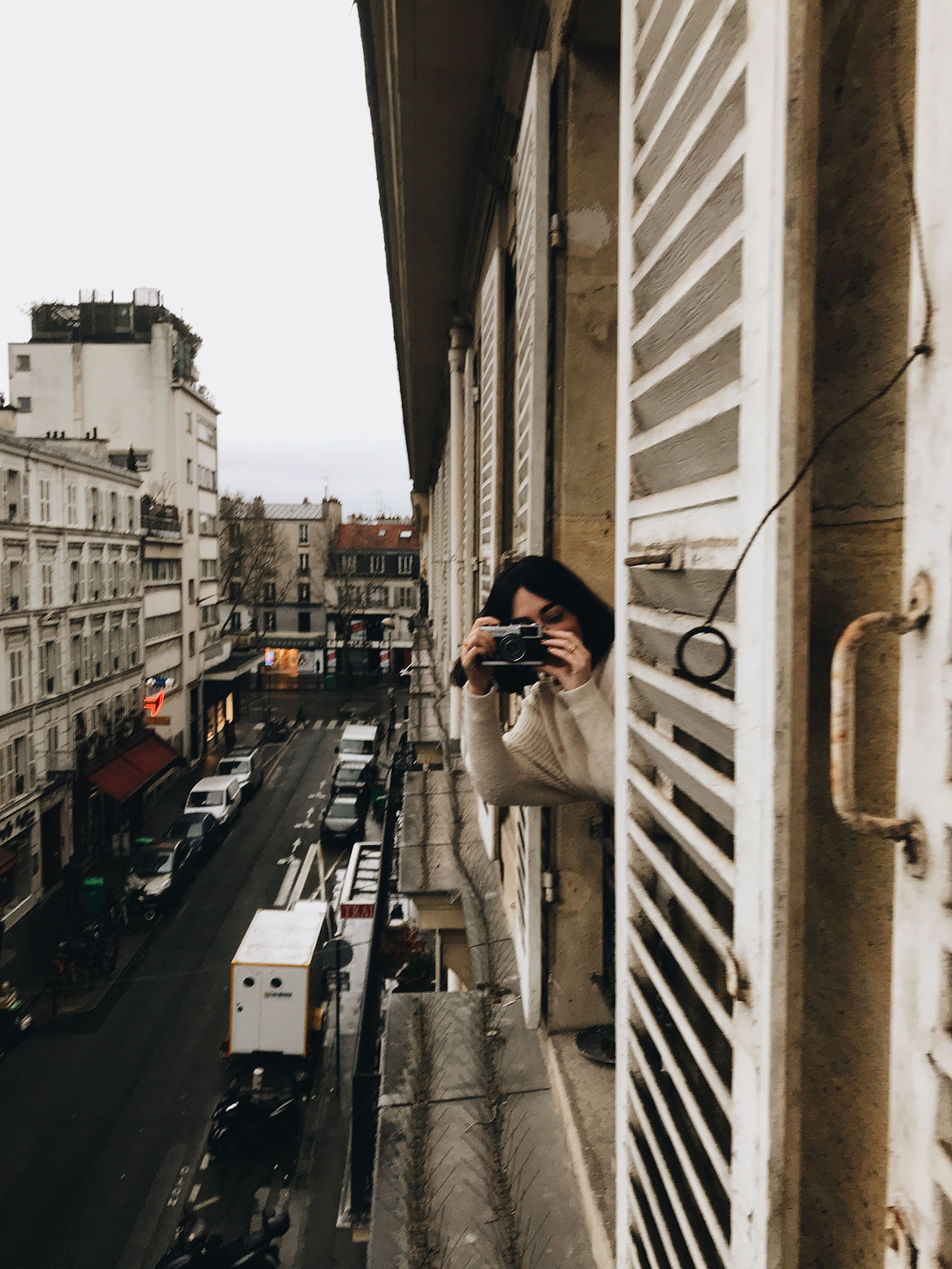 Top Canadian travel blogger Cee Fardoe of Coco & Vera takes a picture from the window of her apartment in Paris