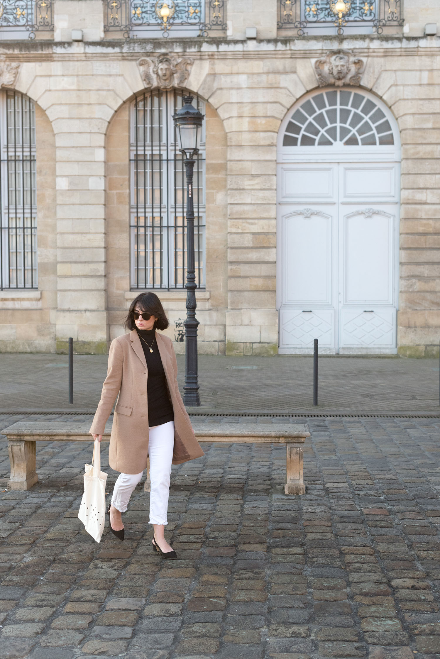 Top Canadian fashion blogger Cee Fardoe of Coco & Vera wears Mavi white jeans and a Le Chateau sweater in Bordeaux, France