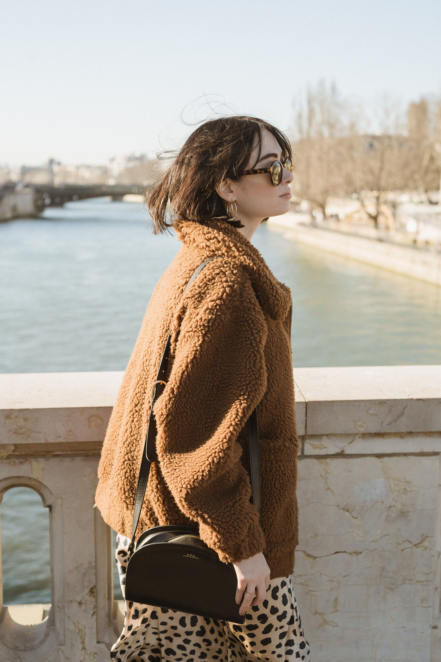Portrait of top Winnipeg fashion blogger Cee Fardoe of Coco & Vera in Paris, wearing & Other Stories sunglasses and a Garage Clothing teddy coat