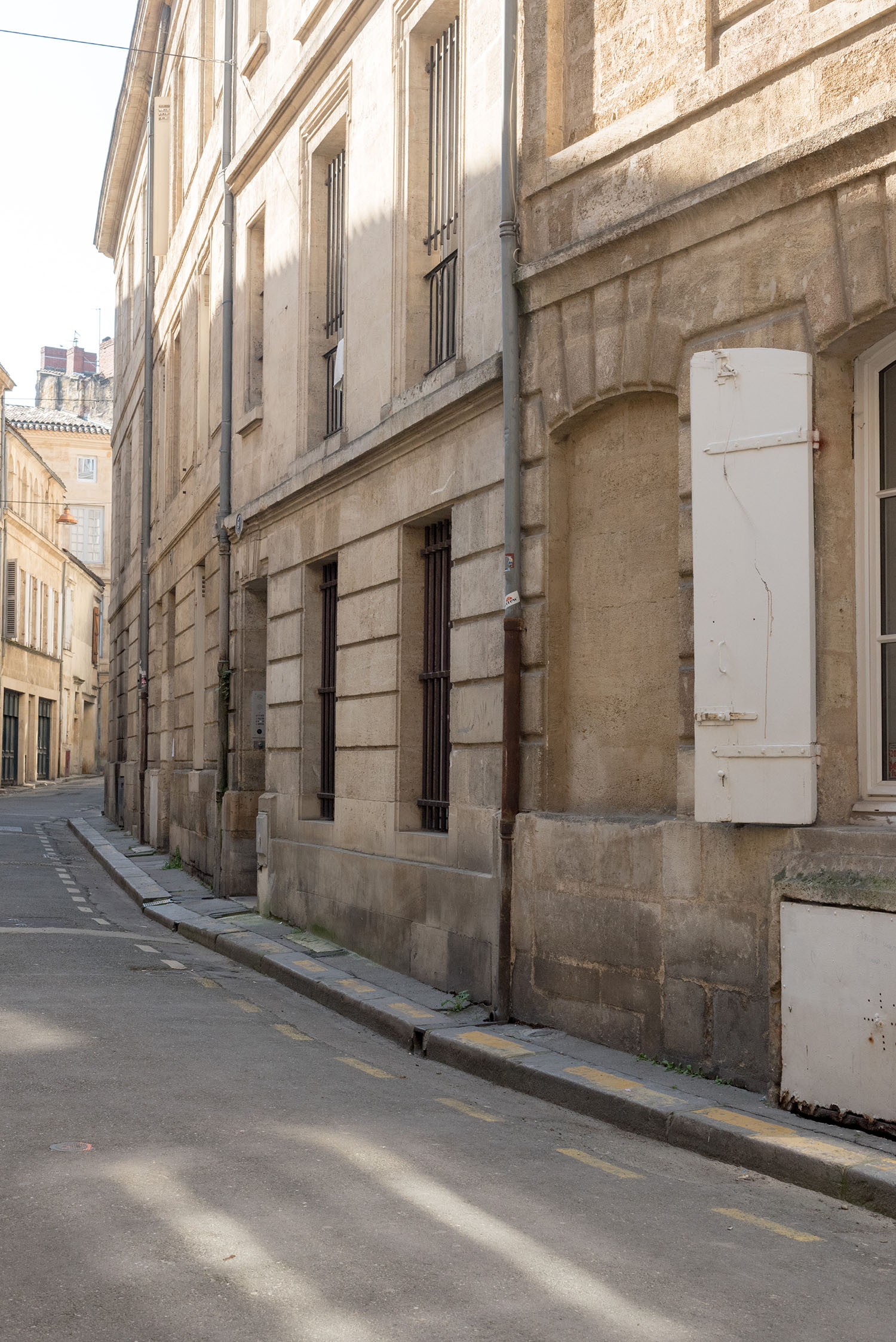 A tranquil medieval street in Bordeaux, France, as captured by top Canadian fashion blogger Cee Fardoe of Coco & Vera