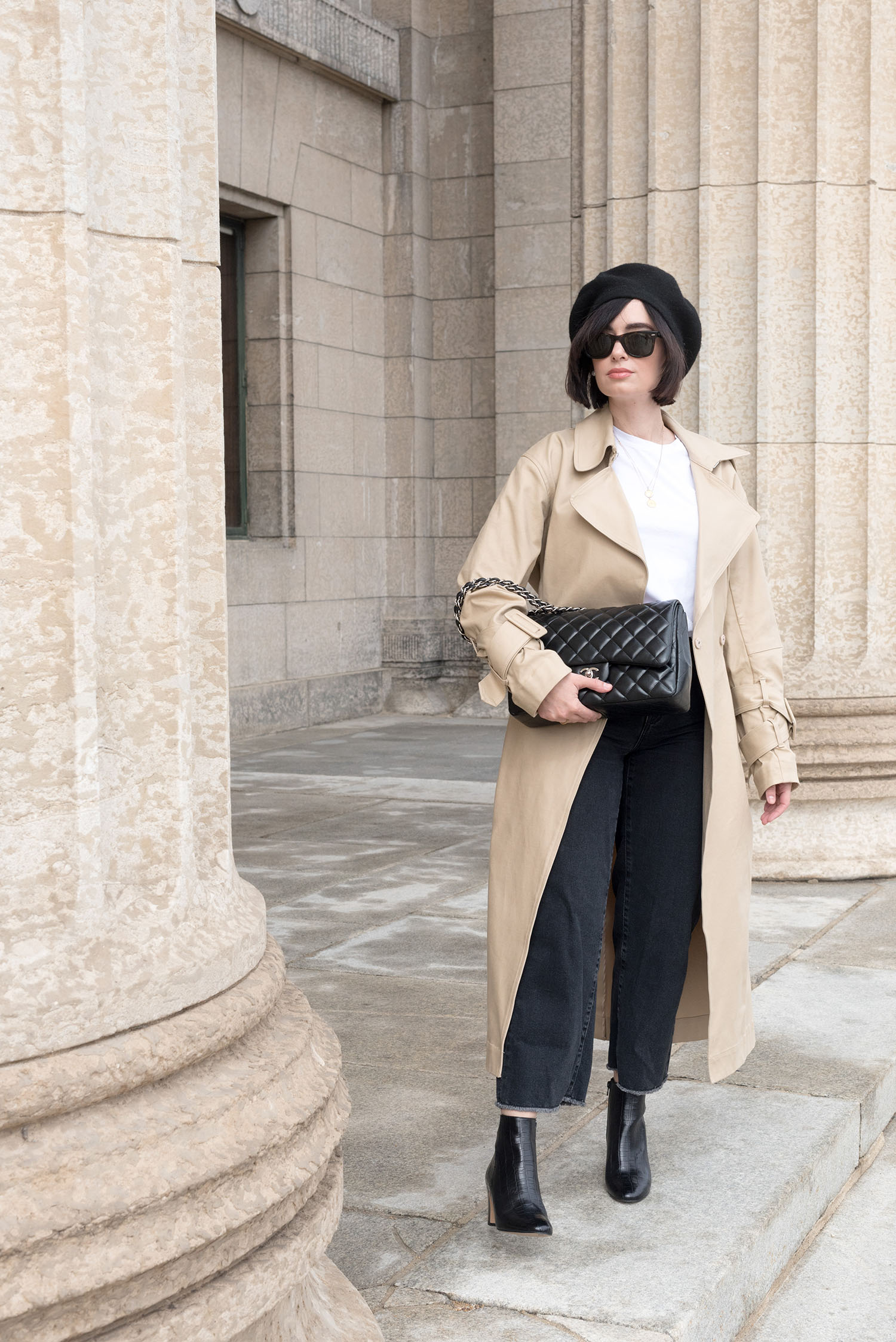 Top Winnipeg fashion blogger Cee Fardoe of Coco & Vera wears Mavi cropped jeans and an H&M trench coat at the Manitoba Legislature