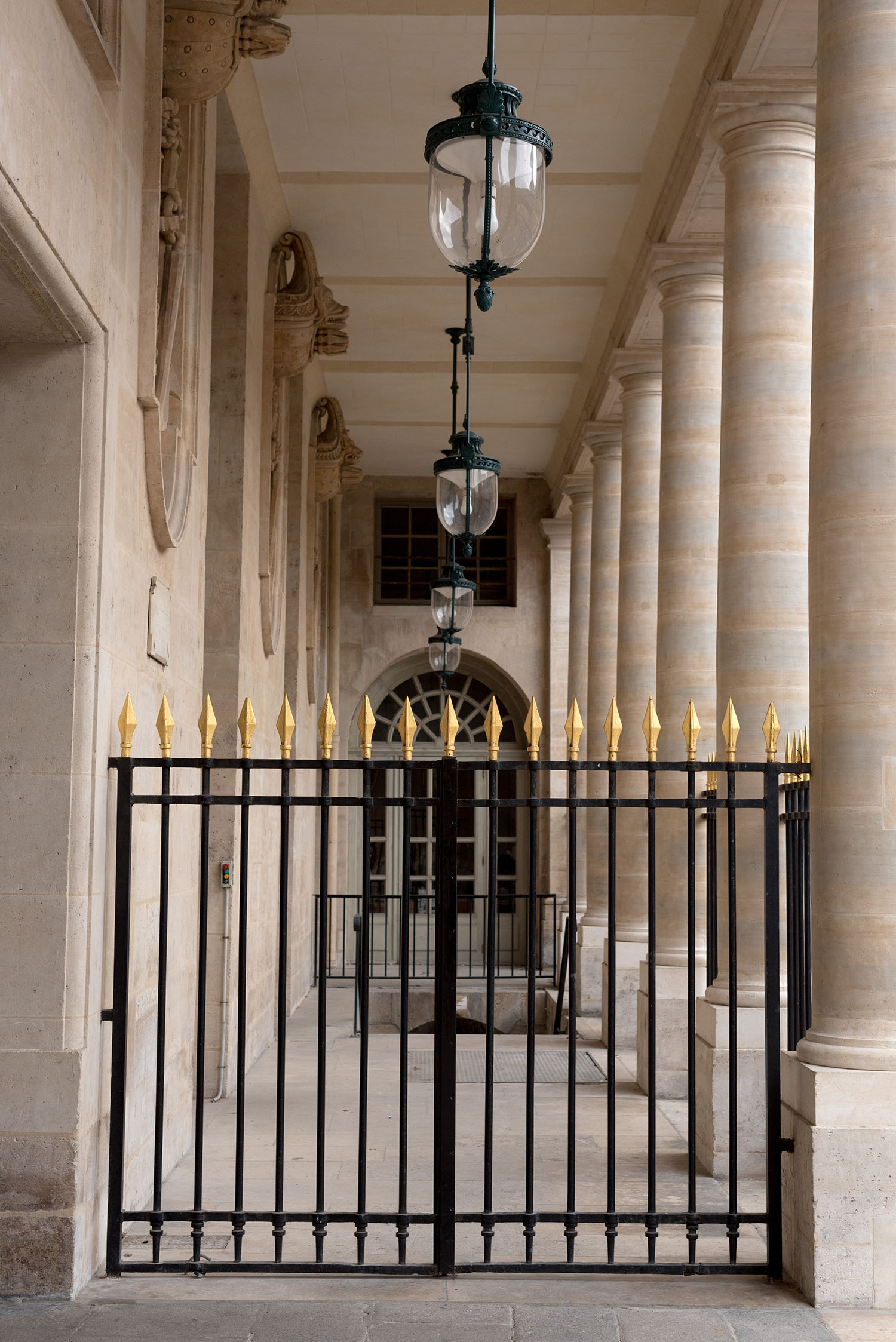 An outdoor corridor in the Palais Royal in Paris, as captured by top Winnipeg travel blogger Cee Fardoe of Coco & Vera