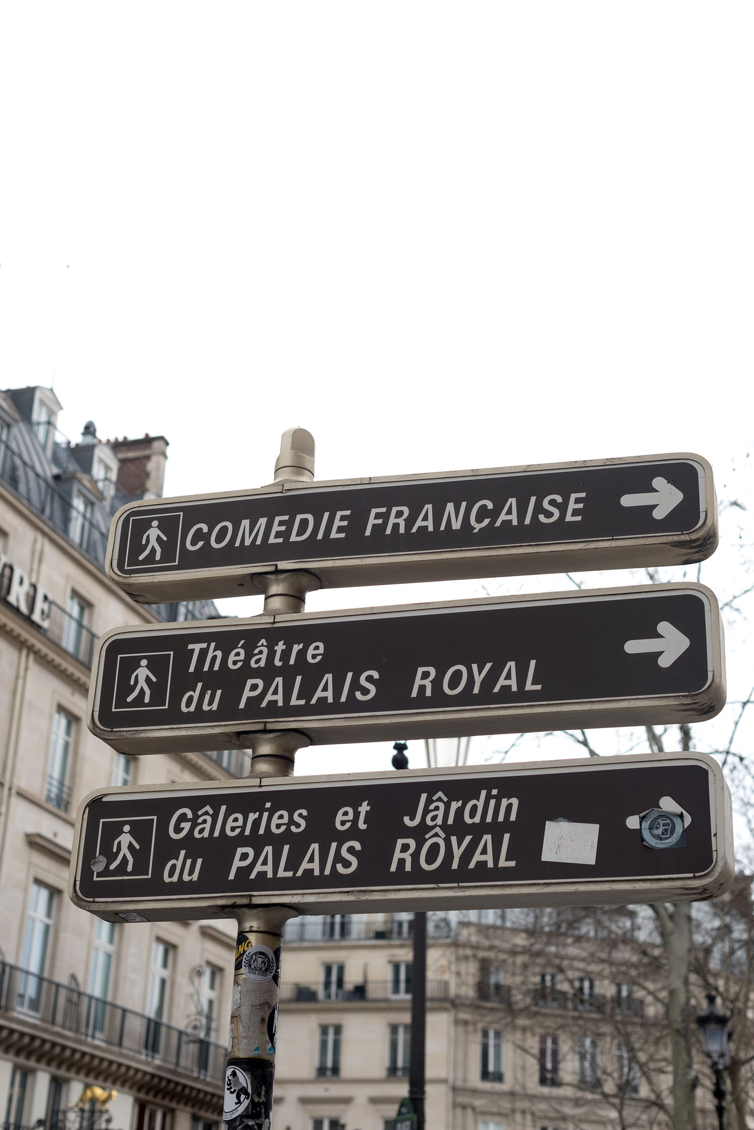 Directional signs at Place Colette in Paris, pointing towards the Comedie Francaise and Palais Royal, as captured by top Canadian travel blogger Cee Fardoe of Coco & Vera