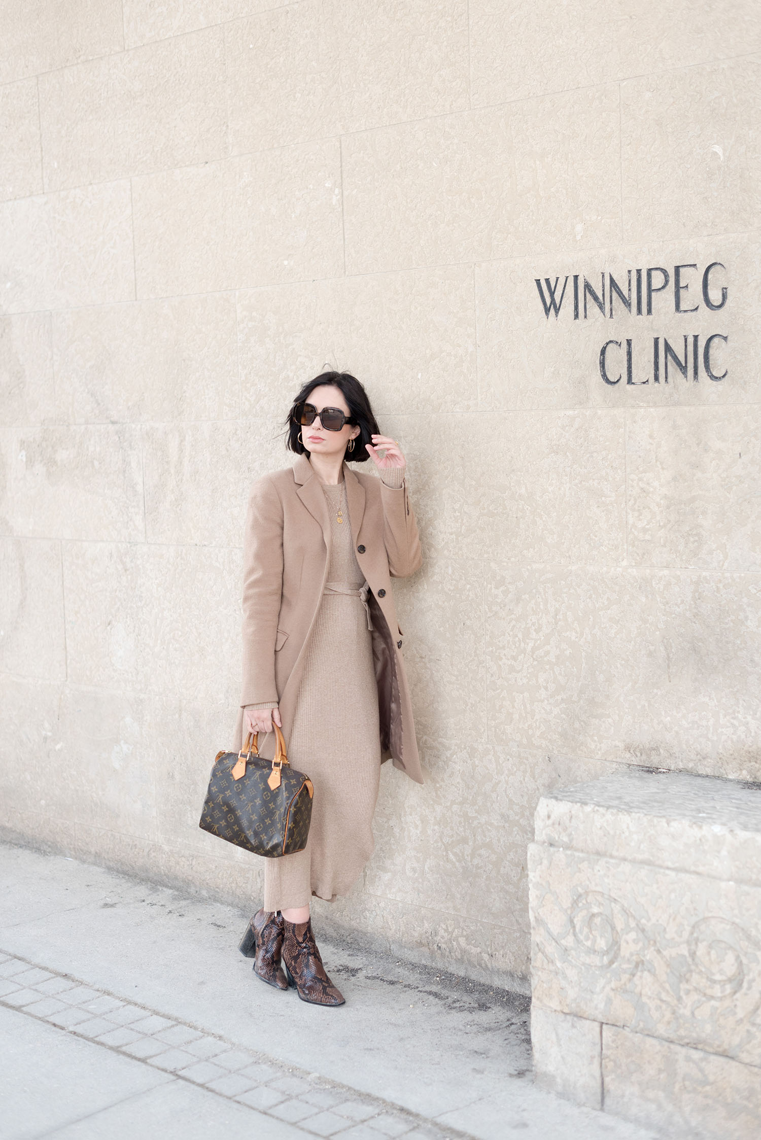 Top Canadian fashion blogger Cee Fardoe of Coco & Vera wears her signature colours in the form of a Uniqlo camel coat and carries a Louis Vuitton Speedy 25 handbag