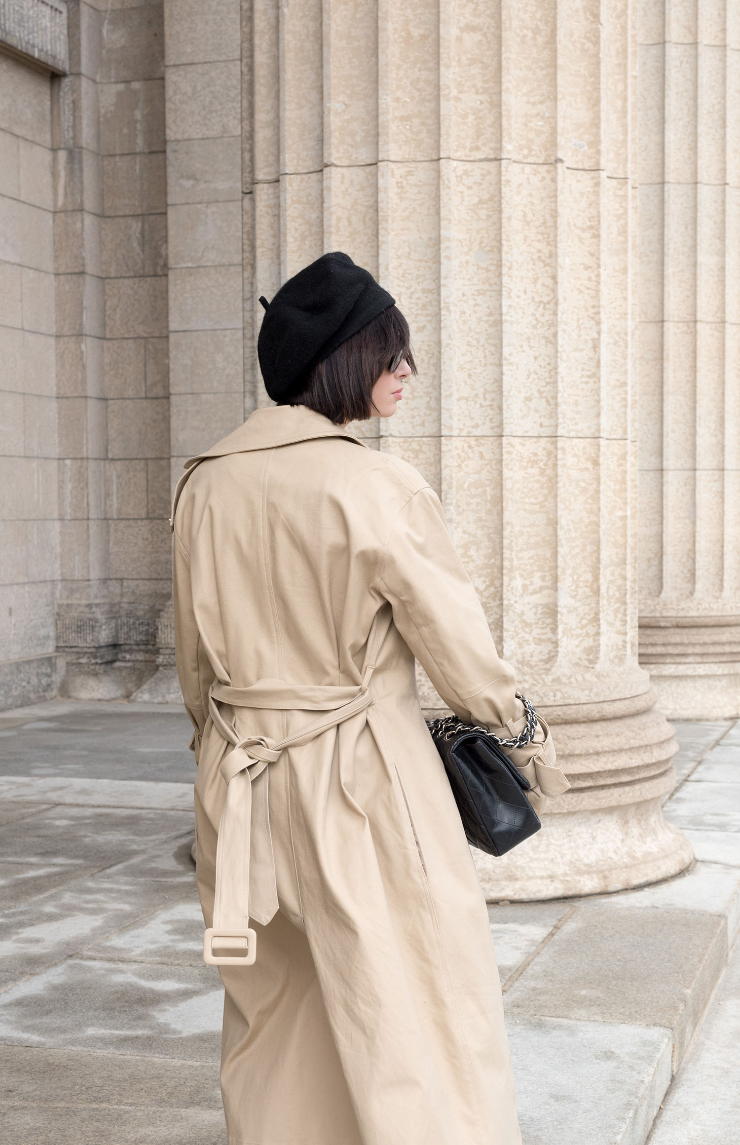Portrait of top Canadian fashion blogger at the Manitoba Legislature, wearing an H&M trench coat and Anthropologie beret