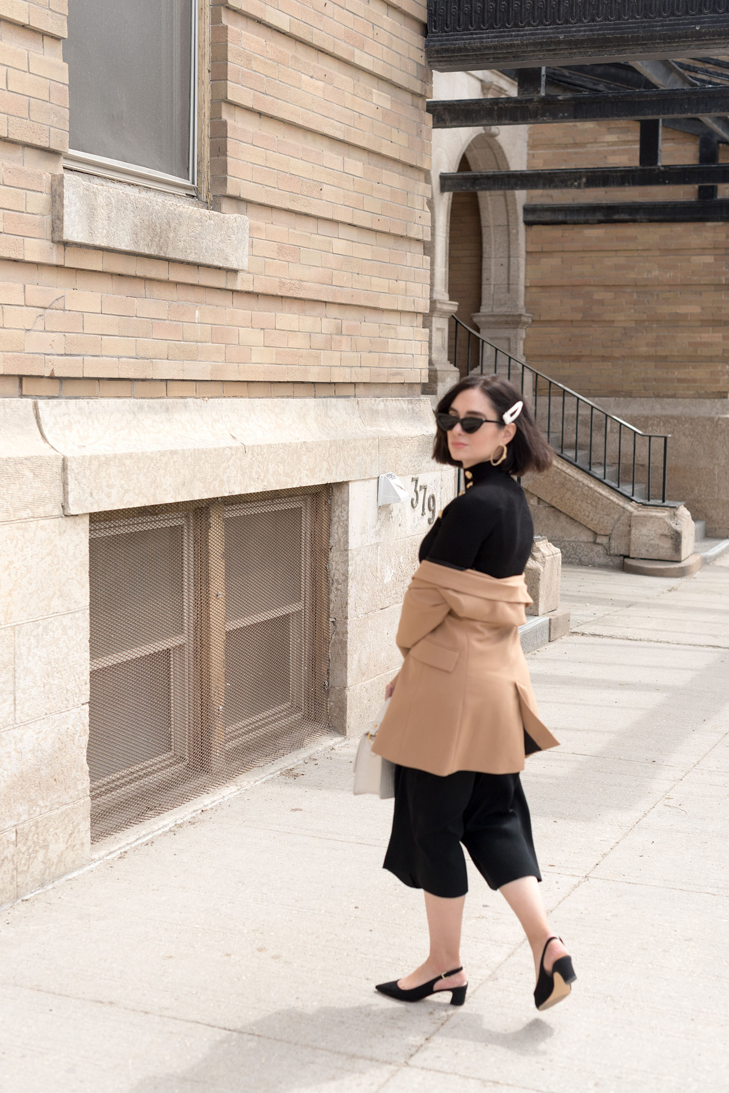 Top Canadian fashion blogger Cee Fardoe of Coco & Vera in the Exchange District of Winnipeg, wearing a Zara blazer and Mango block heels, sixteen years after her high school graduation