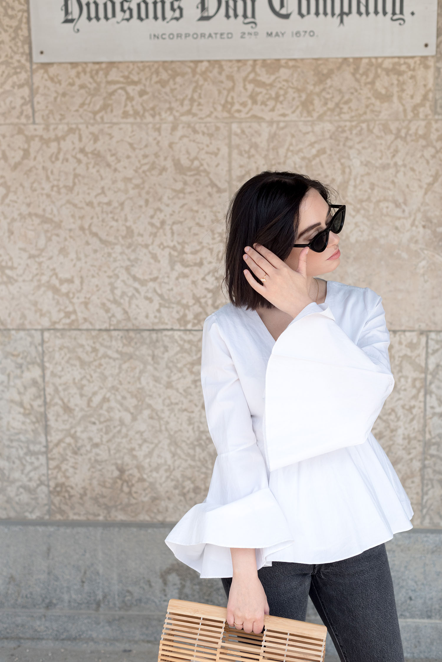 Portrait of top Canadian fashion blogger Cee Fardoe of Coco & Vera wearing Zara cat eye sunglasses