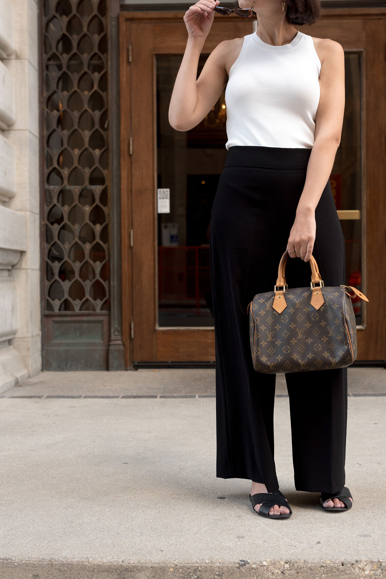 Outfit details on top Canadian fashion blogger Cee Fardoe of Coco & Vera, including Aldo leather slides and Zara trousers, while she talks about living backwards
