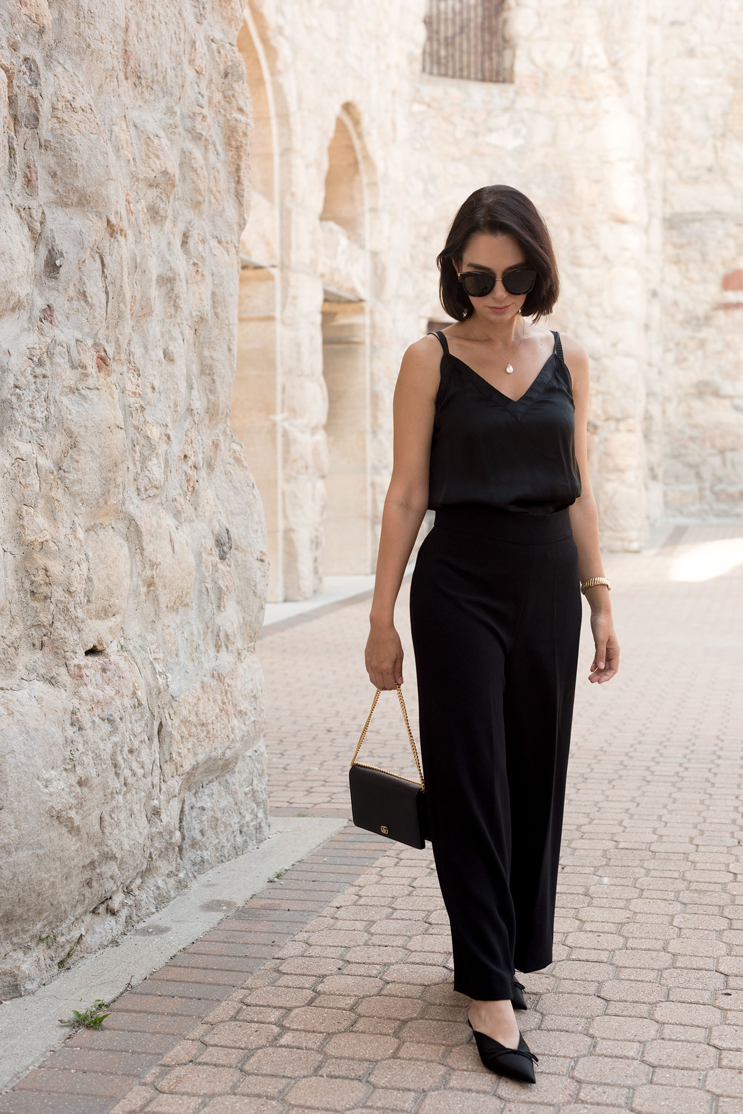 Top Canadian fashion blogger Cee Fardoe of Coco & Vera wears an Aritzia silk camisole and carries a Gucci Marmont handbag, while exploring her definition of femininity