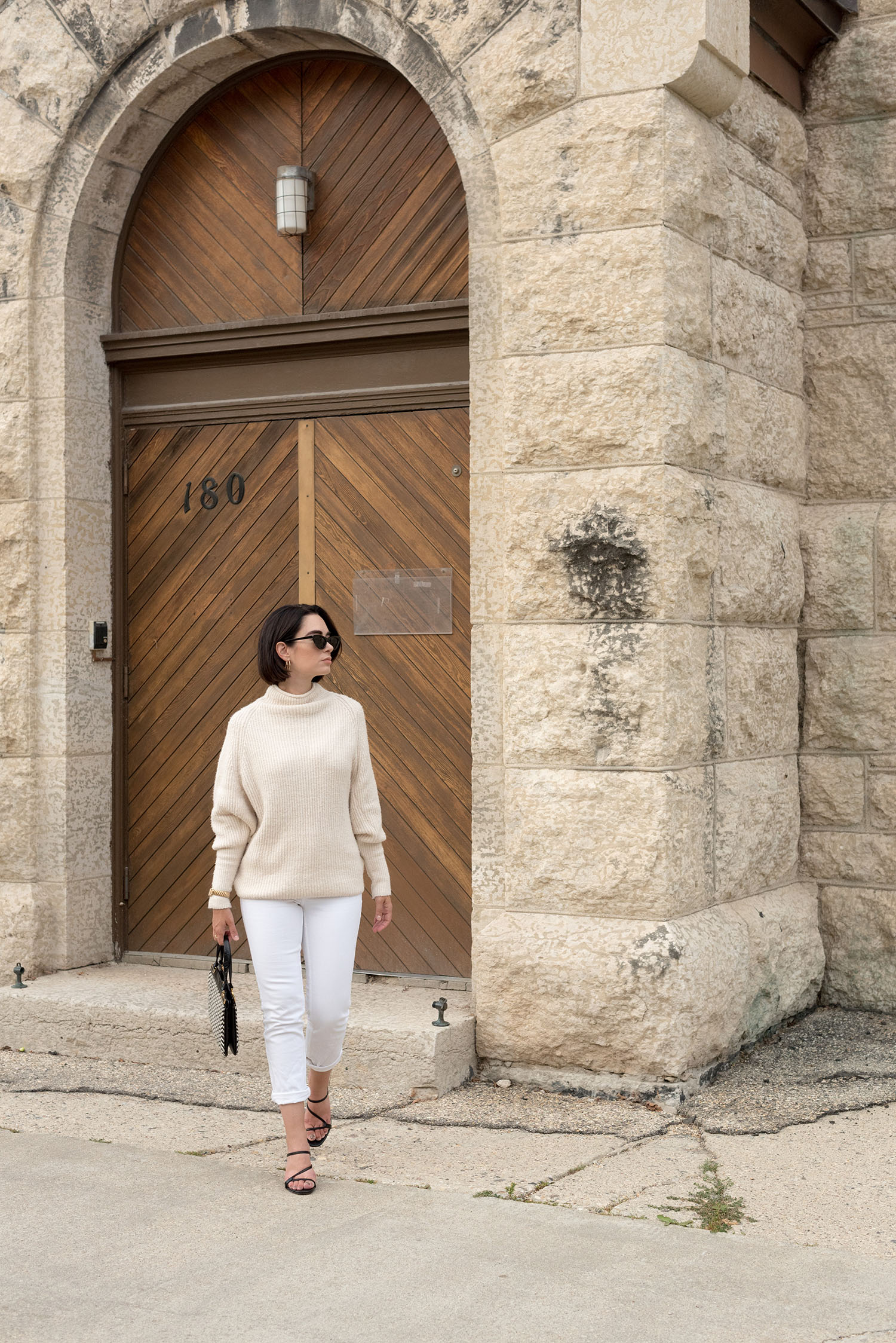 Top Canadian fashion blogger Cee Fardoe of Coco & Vera wears a cream Glam Sash sweater and Mango white jeans