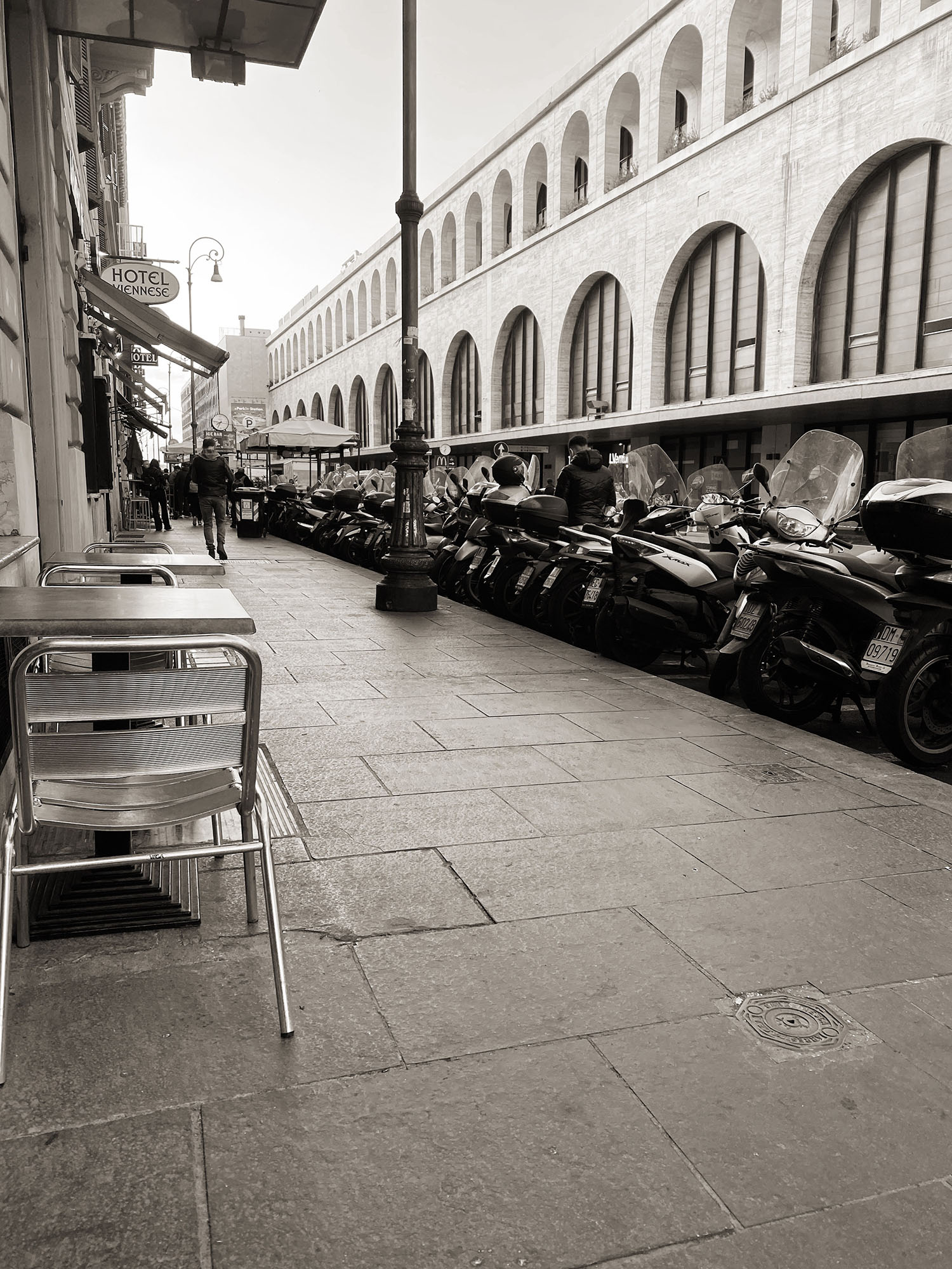 Coco & Vera - Motorcyles and cafe tables across the street from Termini Station in Rome