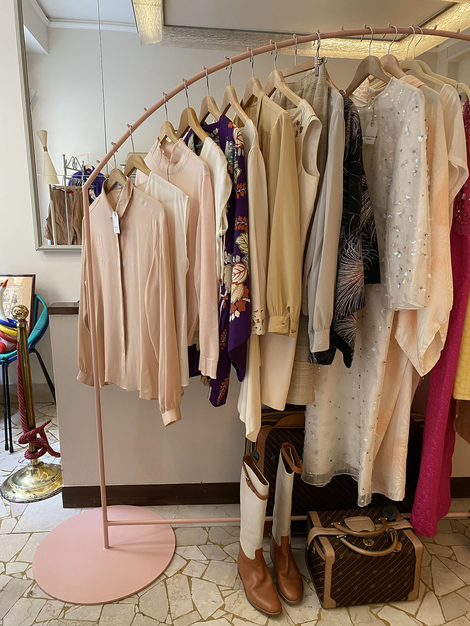 Coco & Vera - Vintage clothes hanging at Boutique Nadine in Firenze