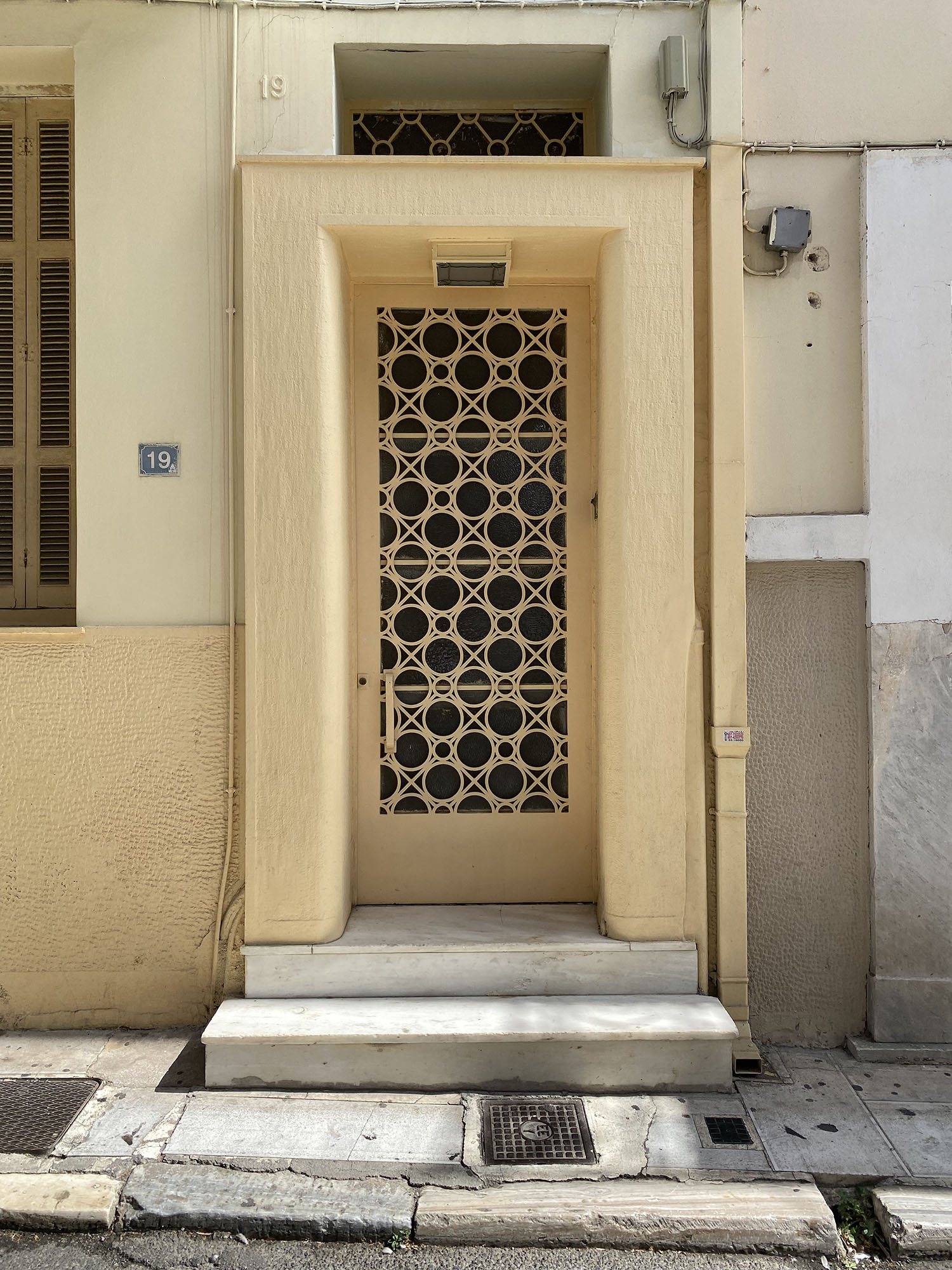 Coco & Vera - Yellow mid-century door in Plaka, Greece