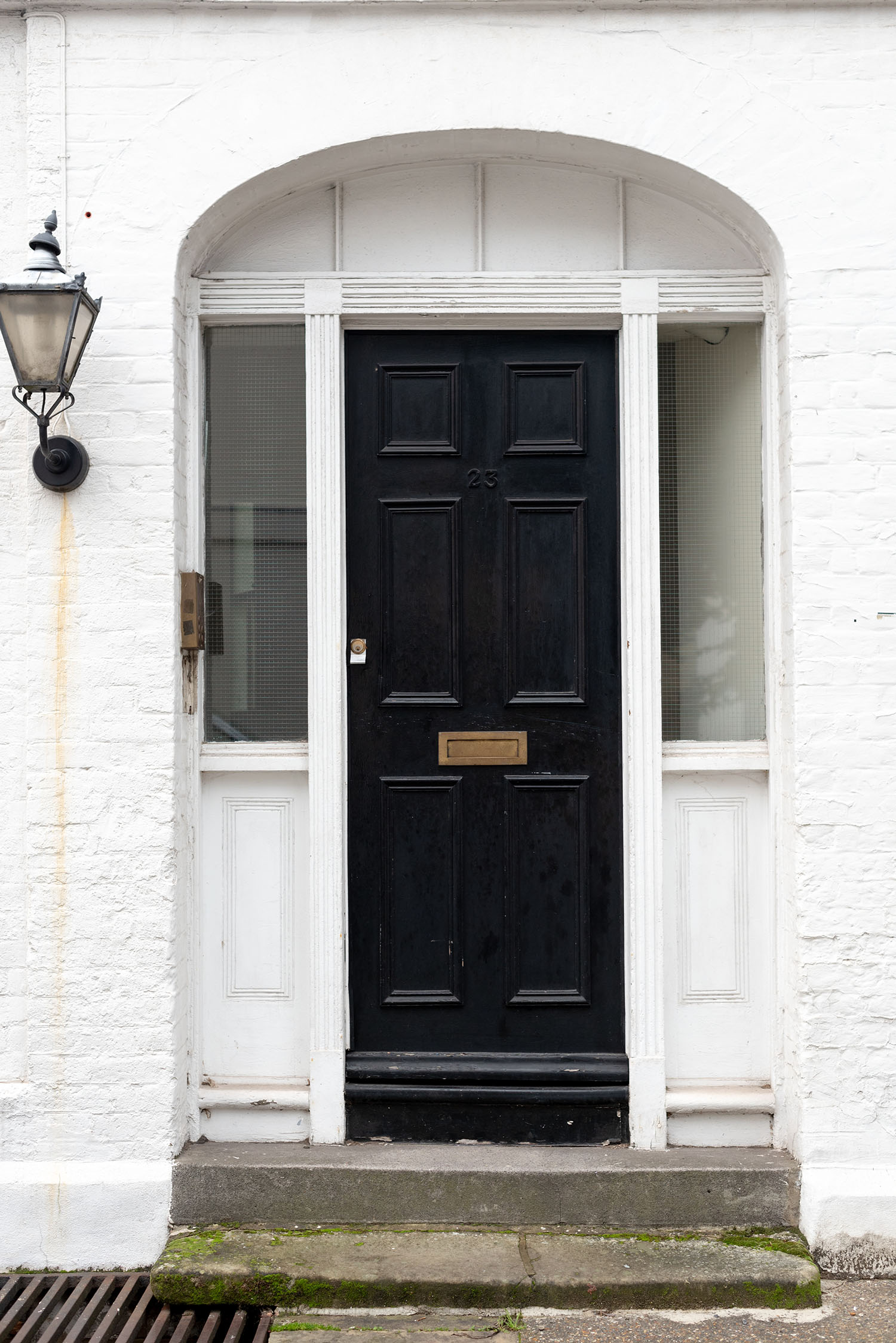 Coco & Vera - Black door on a white building in London, England