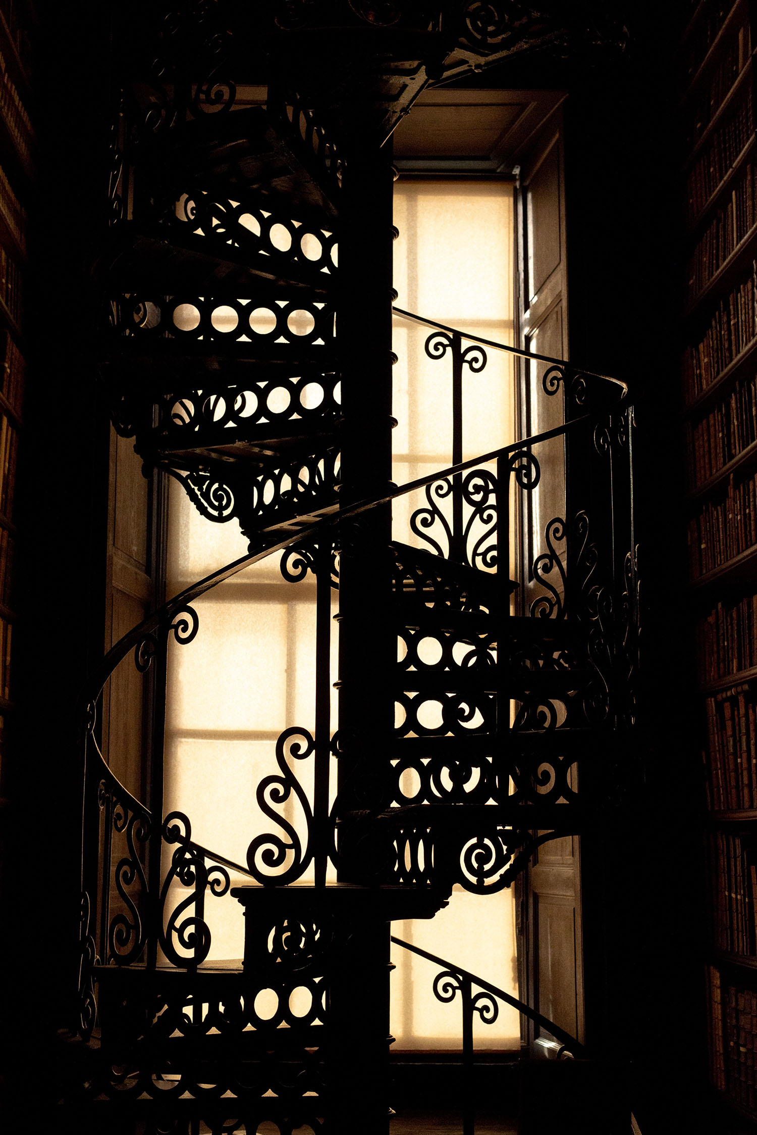 Coco & Vera - Spiral staircase in the Long Room at Trinity College, Dublin