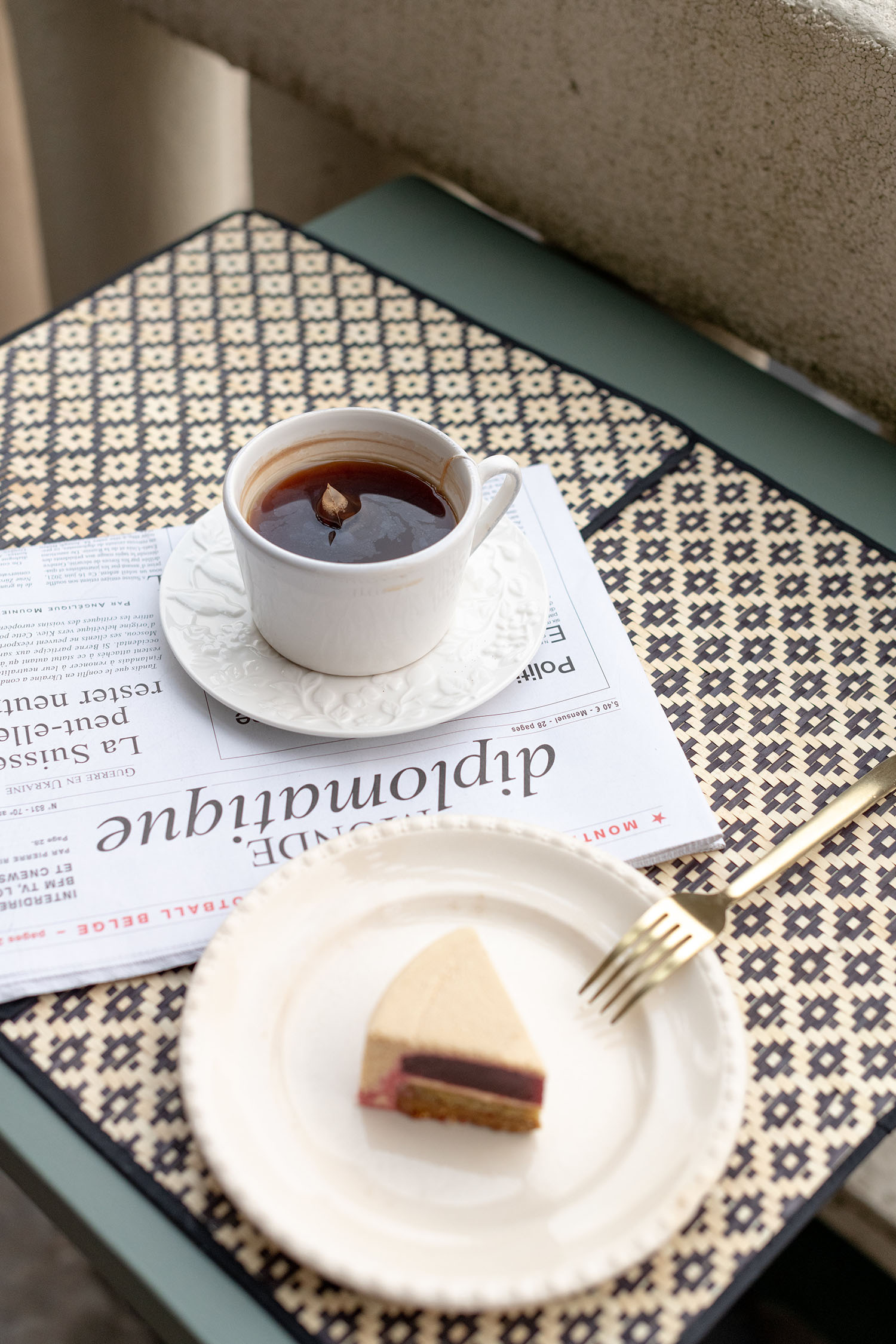 Coco & Voltaire - Zara Home teacup and saucer, Le Monde Diplomatique newspaper, Philippe Conticini cake