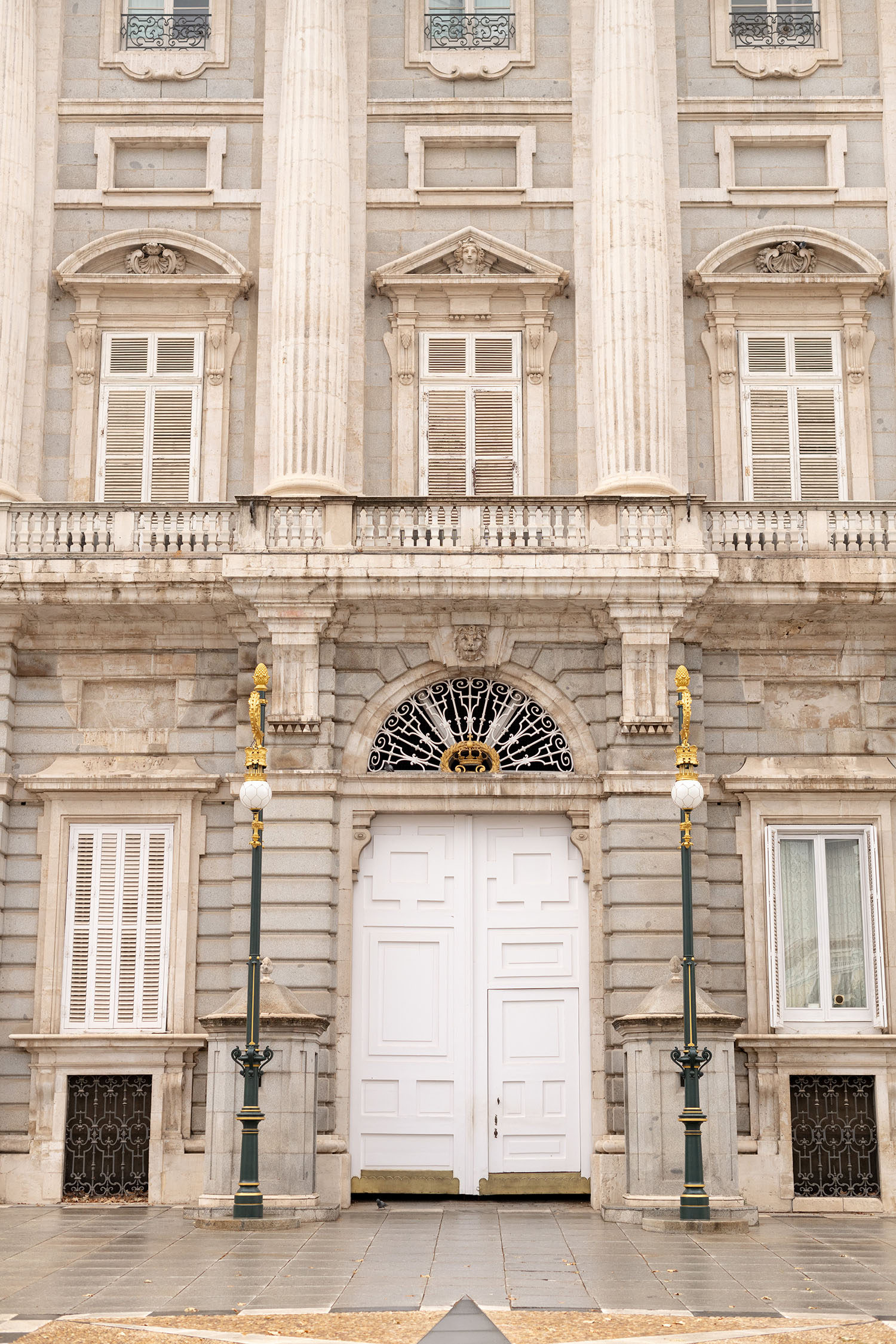 Coco & Voltaire - White door on the Palacio Real in Madrid
